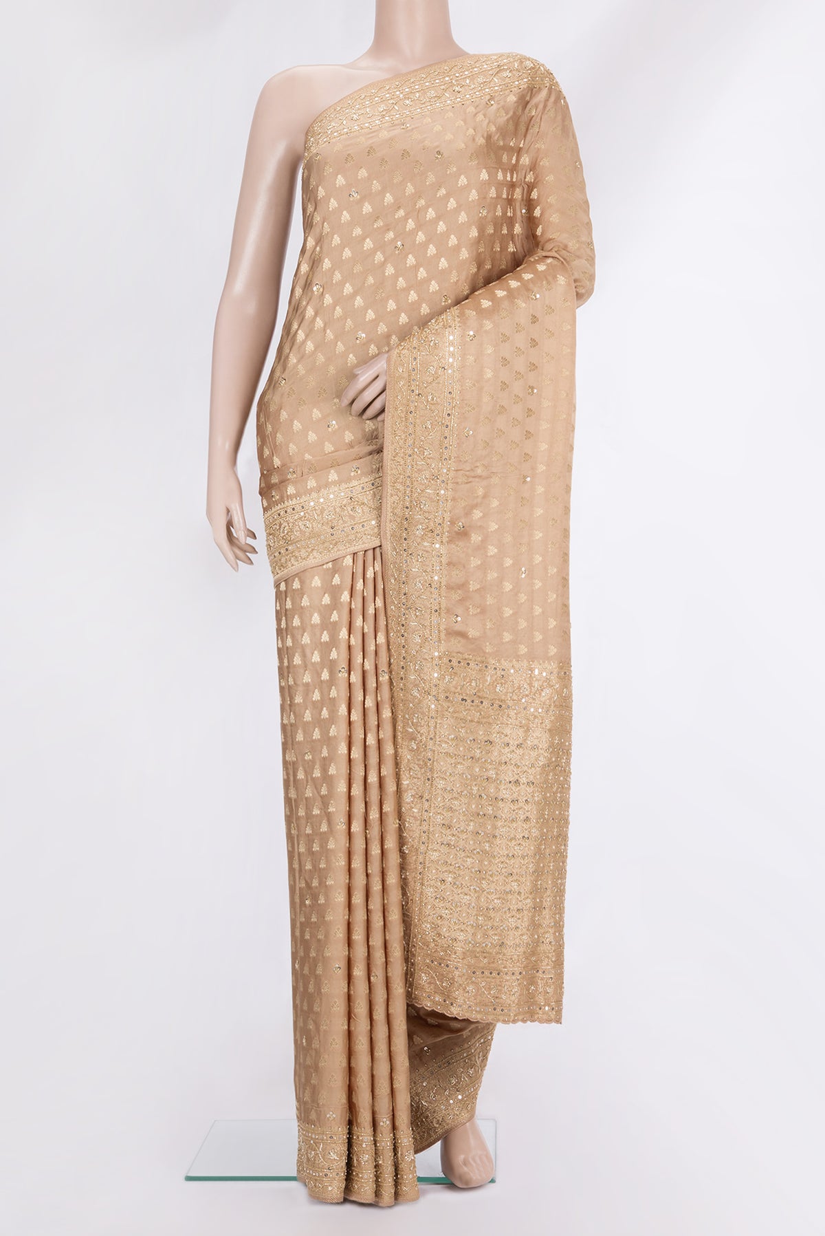 Sandal Satin Saree with Embroidered on the body and Embroidered Border.  displayed on a mannequin
