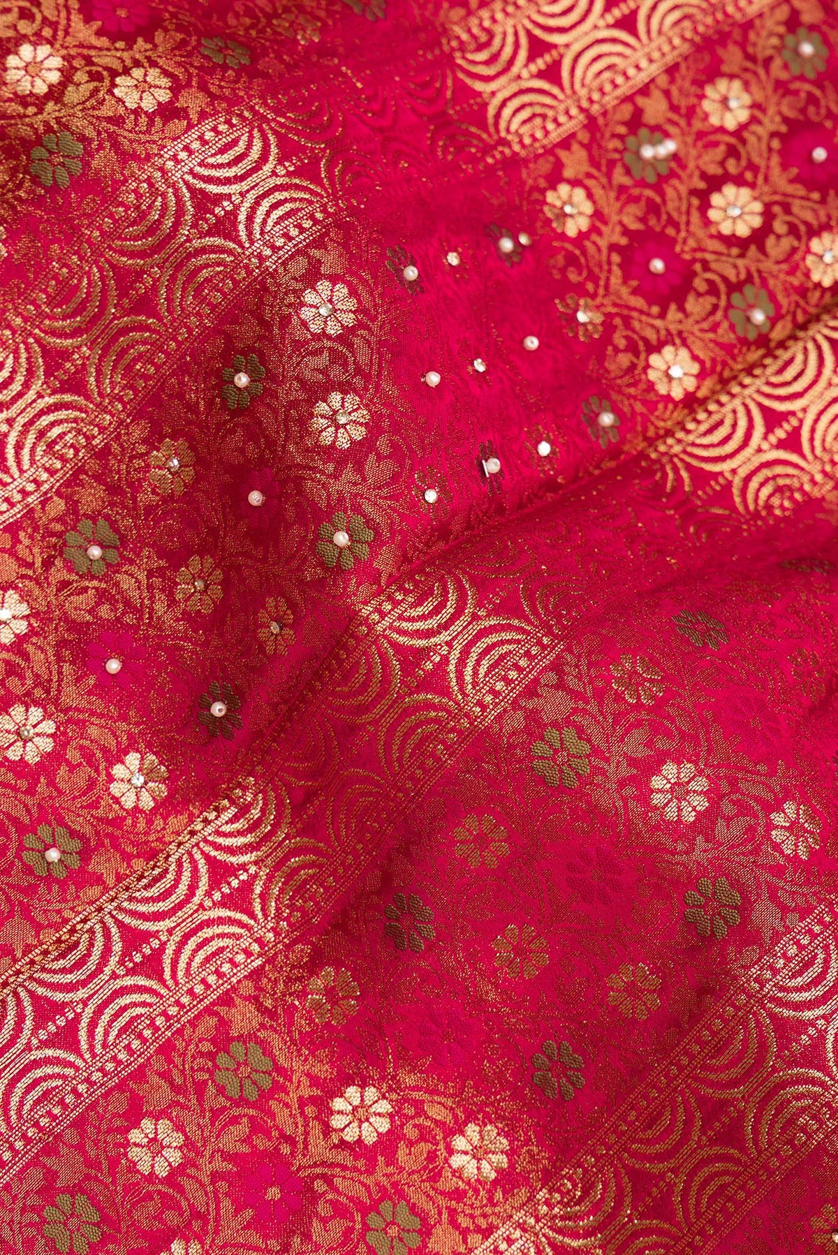 Close up of Dark Pink Dual Tone Crepe Saree with Embroidered on the body and Sequin Border.  displaying folds