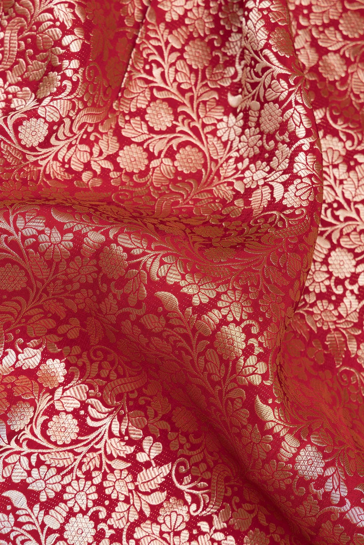 Close up of Red Dual Tone Blended Banarasi Silk Saree with Zari Brocade on the body and Sequin Border.  displaying folds