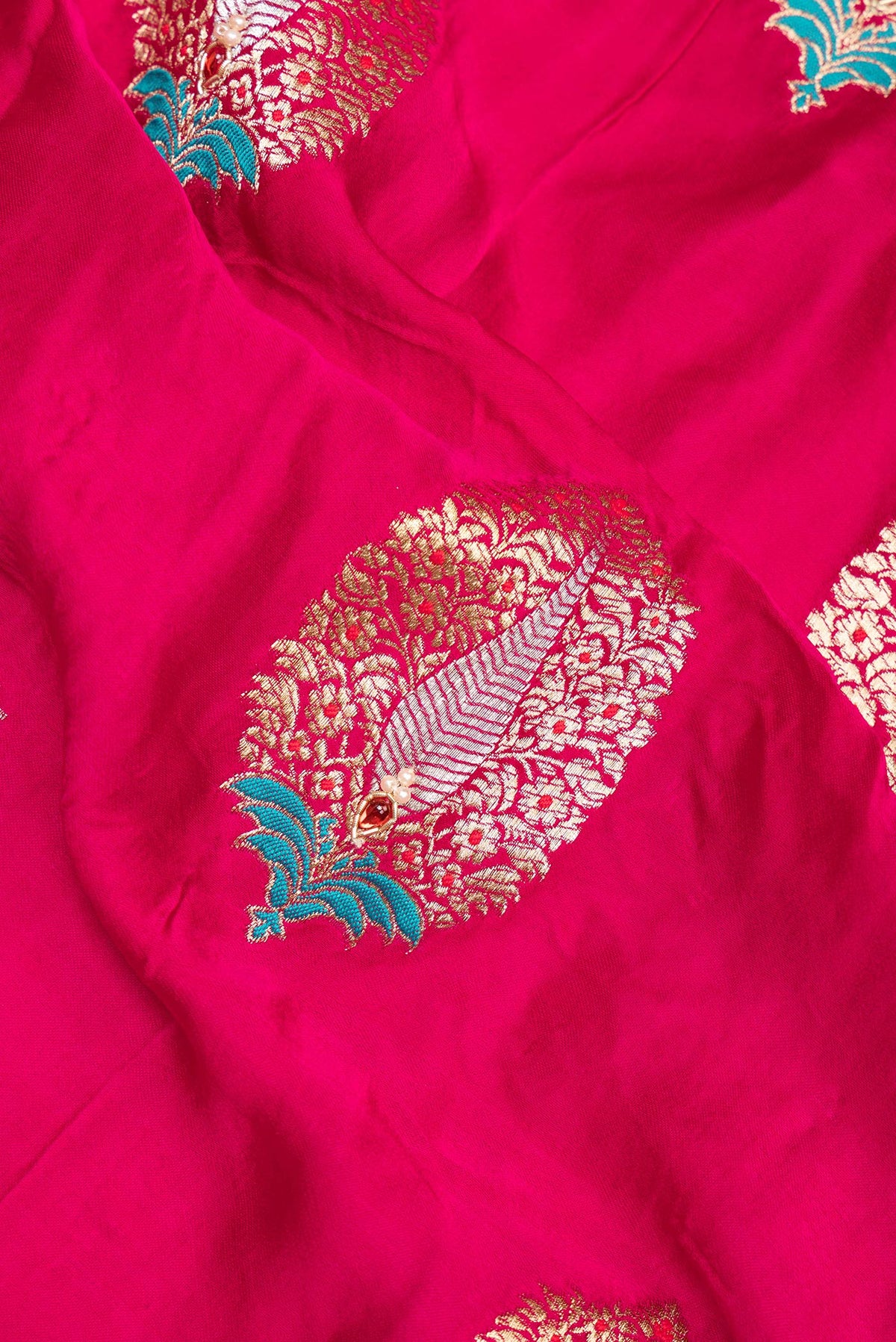 Close up of Dark Pink Dual Tone Satin Saree with Embroidered on the body and Embroidered Border.  displaying folds
