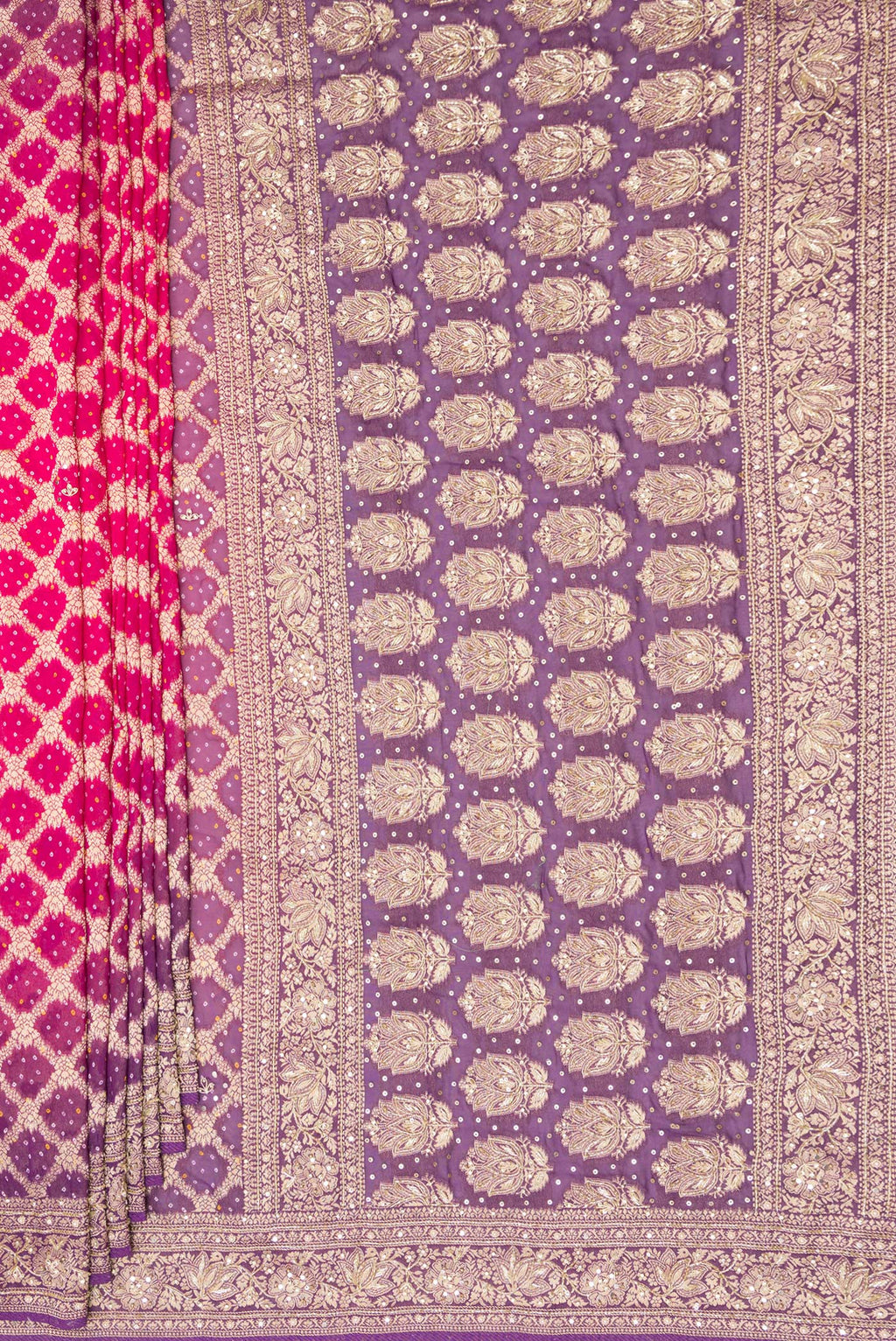 Pleats and pallu of Pink and Lavender Color Banarasi Georgette Saree with Bandhani Print on the body and Embroidered Border. 