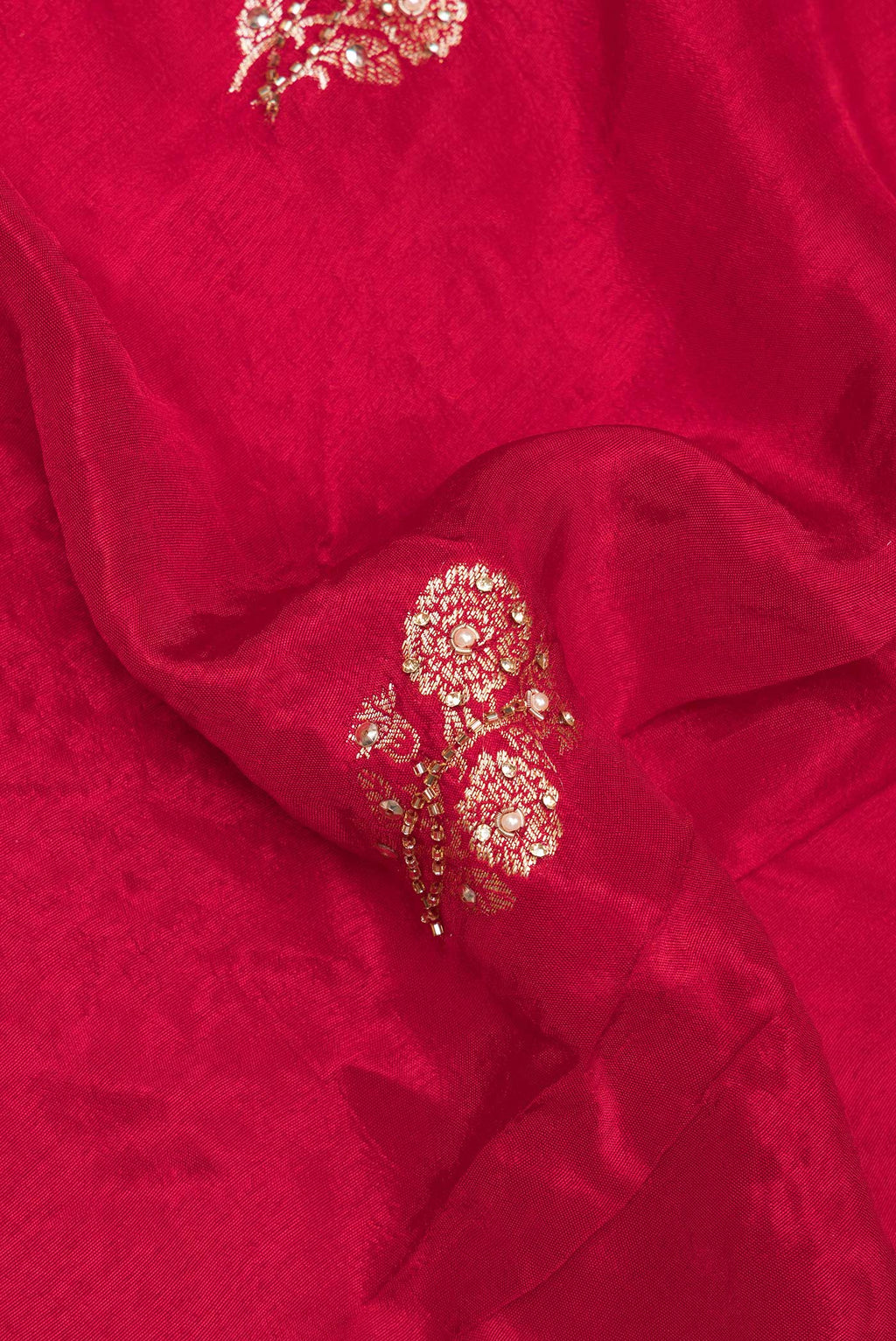 Close up of Red Blended Satin Silk Saree with Embroidered on the body and Sequin Border.  displaying folds