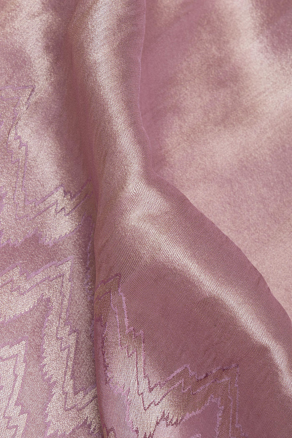 Close up of Lavender Dual Tone Blended Tissue Silk Saree with Zari Brocade on the body and Sequin Border.  displaying folds