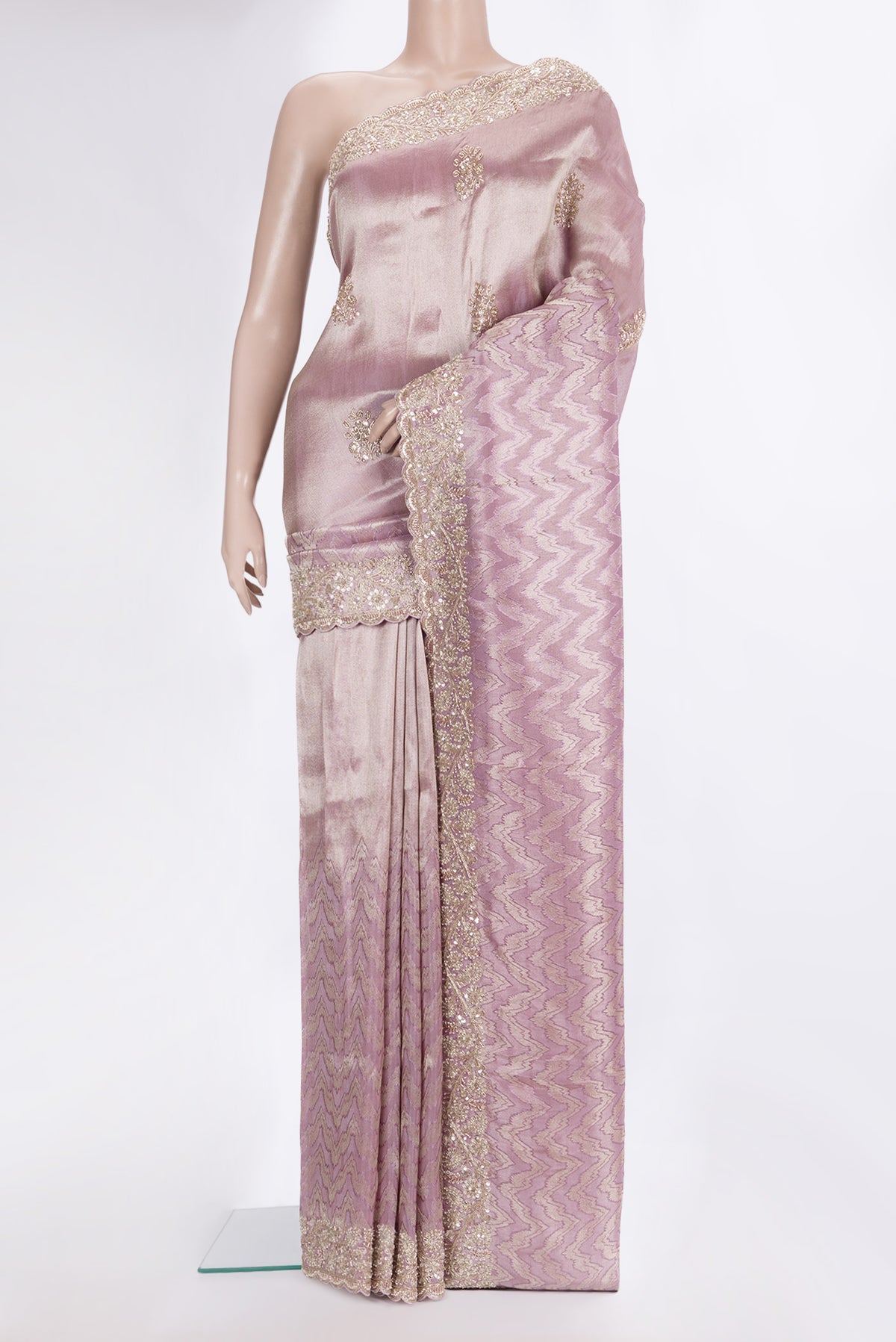 Lavender Dual Tone Blended Tissue Silk Saree with Zari Brocade on the body and Sequin Border.  displayed on a mannequin