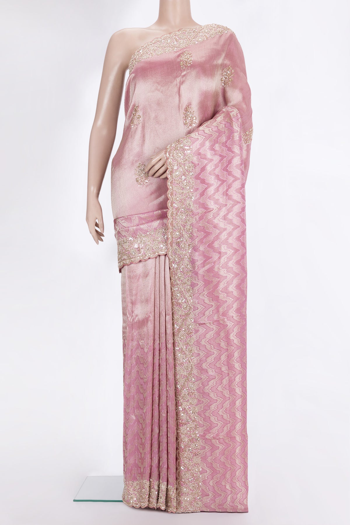 Rose pink Tissue Saree with Zari Brocade on the body and Sequin Border.  displayed on a mannequin