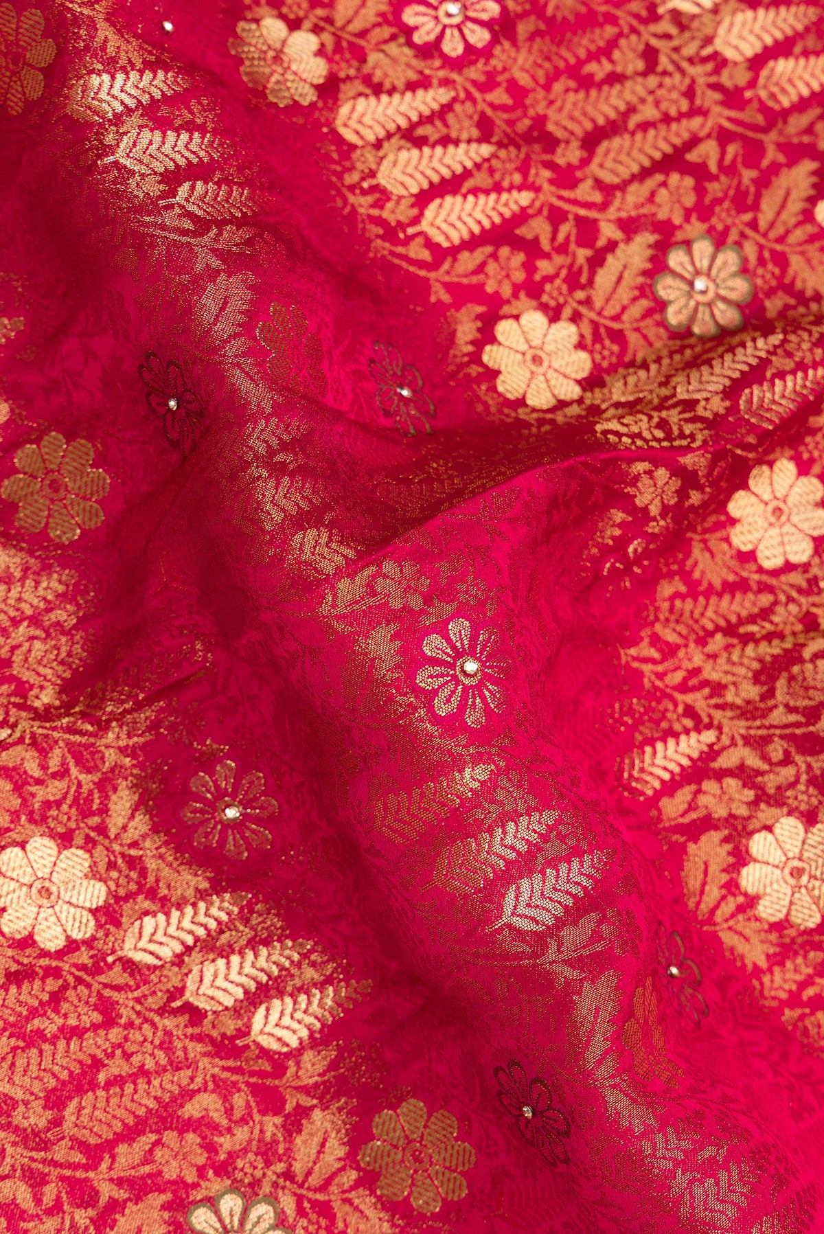 Close up of Imperial Red Crepe Saree with Embroidered on the body and Sequin Border.  displaying folds