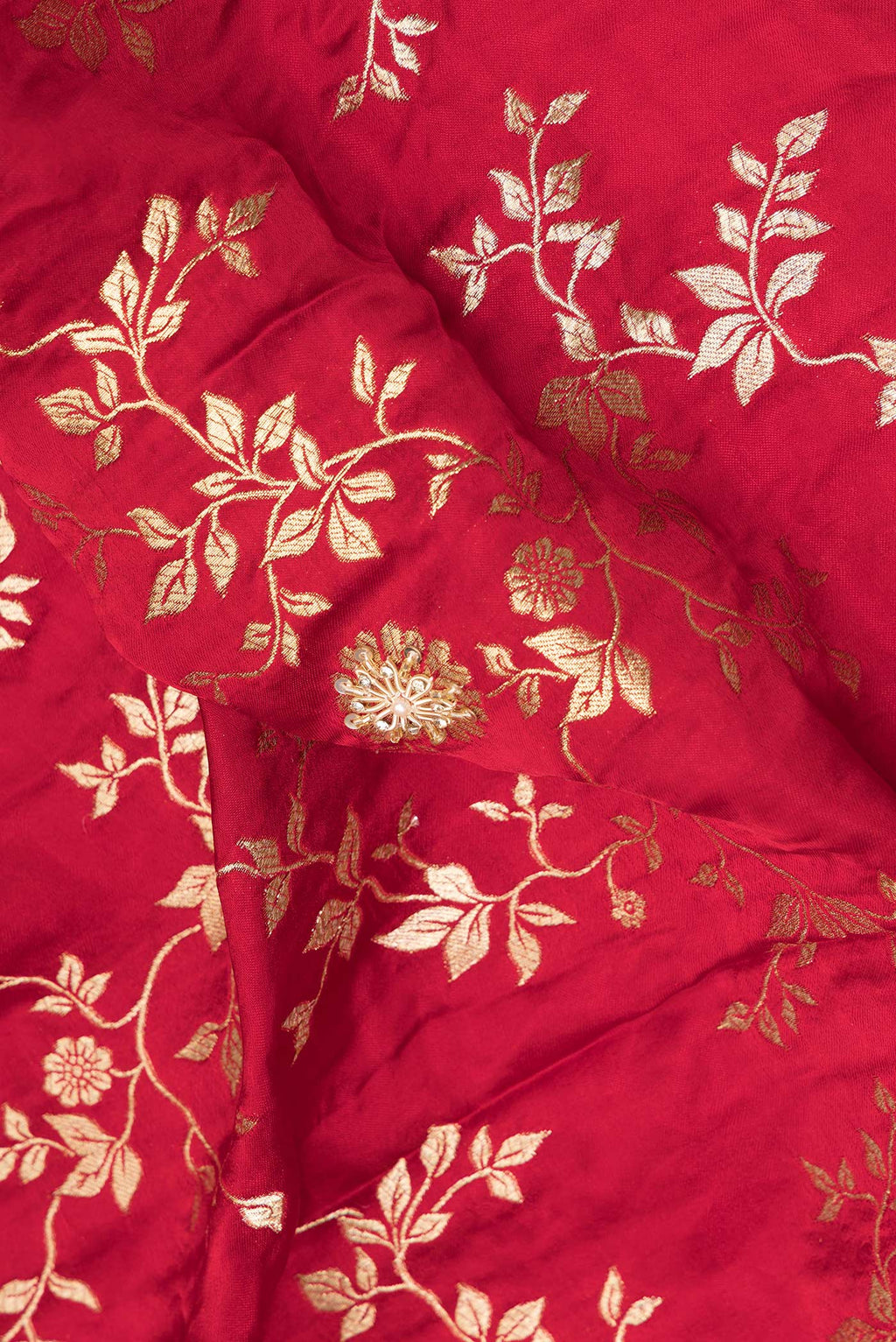 Close up of Deep Red Satin Saree with Embroidered on the body and Sequin Border.  displaying folds