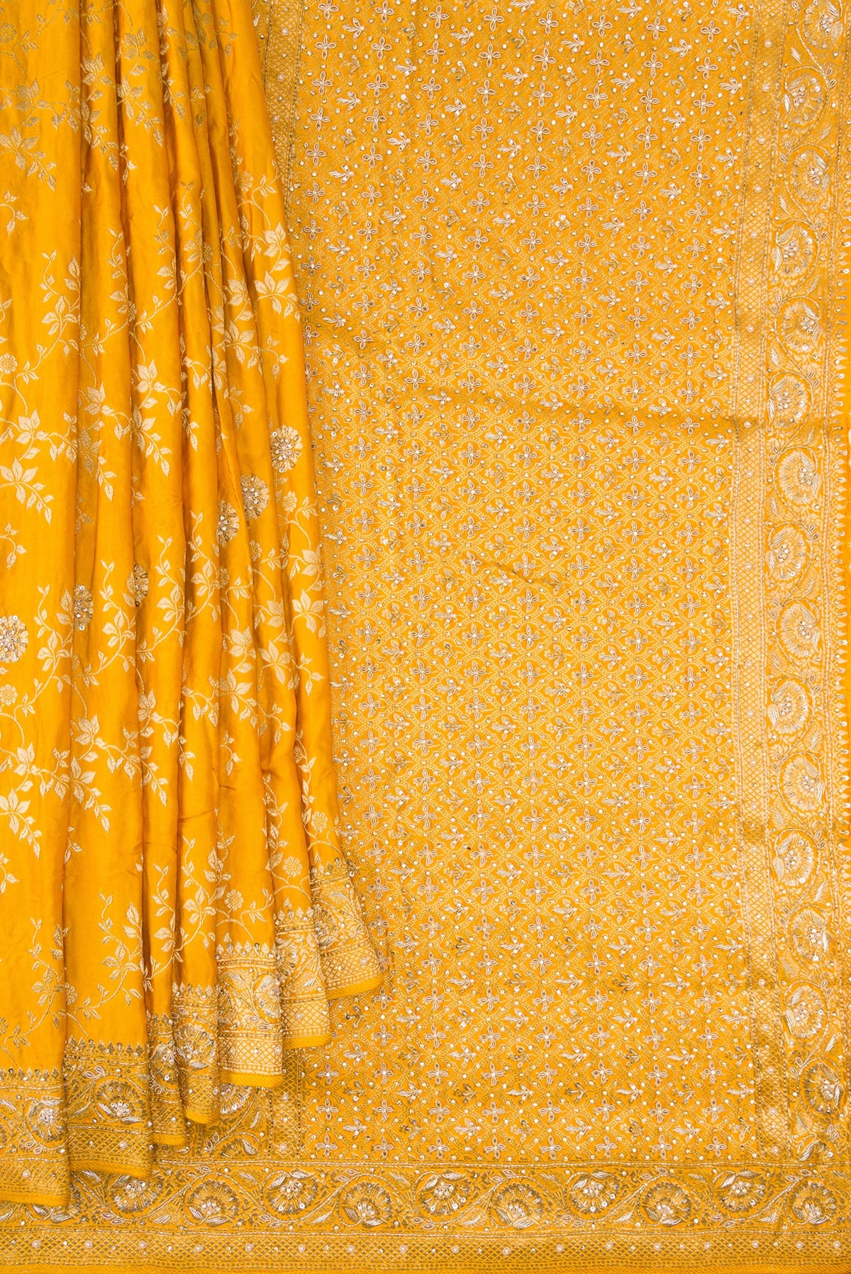 Pleats and pallu of Yellow Satin Crepe Saree with Embroidered on the body and Sequin Border. 