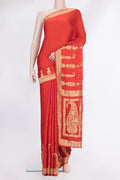 Orange Satin Saree with Plain Body and Sequin Border.  displayed on a mannequin