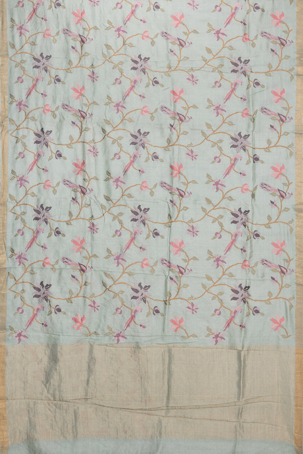 Flat view of Light Green Tussar Saree with Embroidered on the body and Zari Border. 