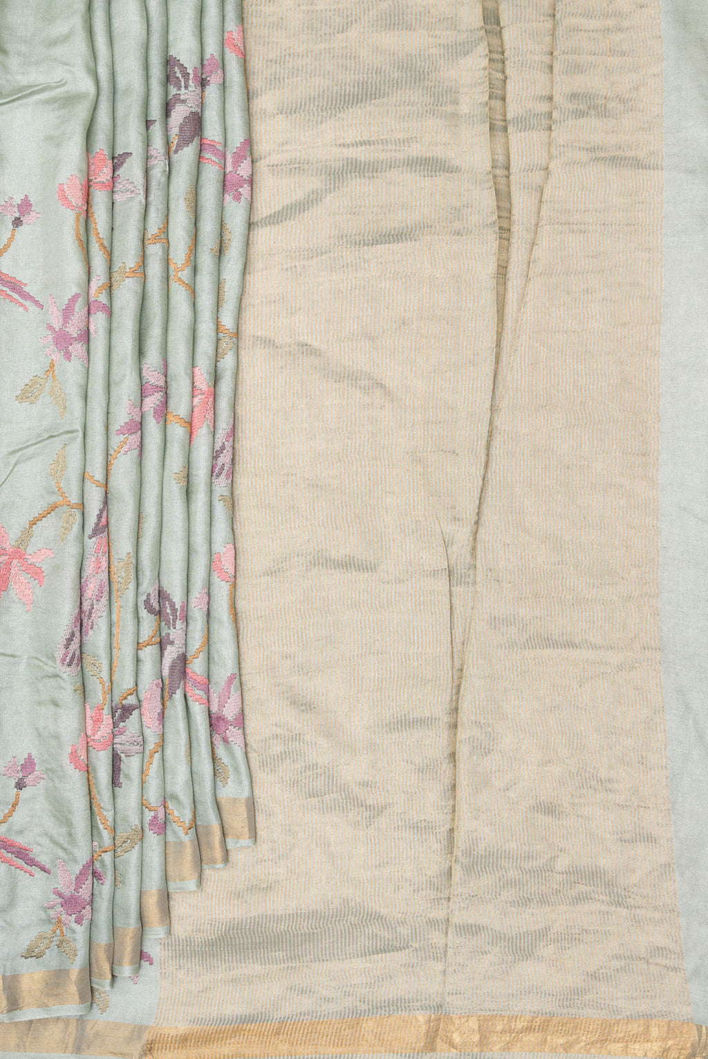 Pleats and pallu of Light Green Tussar Saree with Embroidered on the body and Zari Border. 