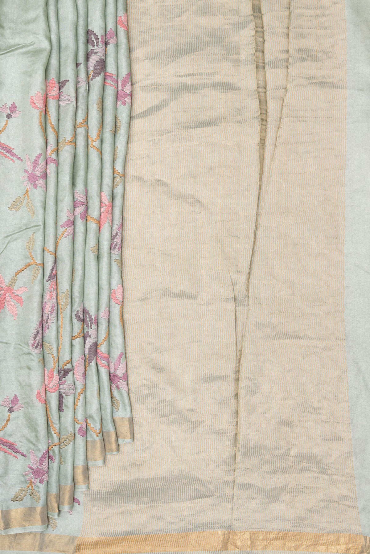 Pleats and pallu of Light Green Tussar Saree with Embroidered on the body and Zari Border. 