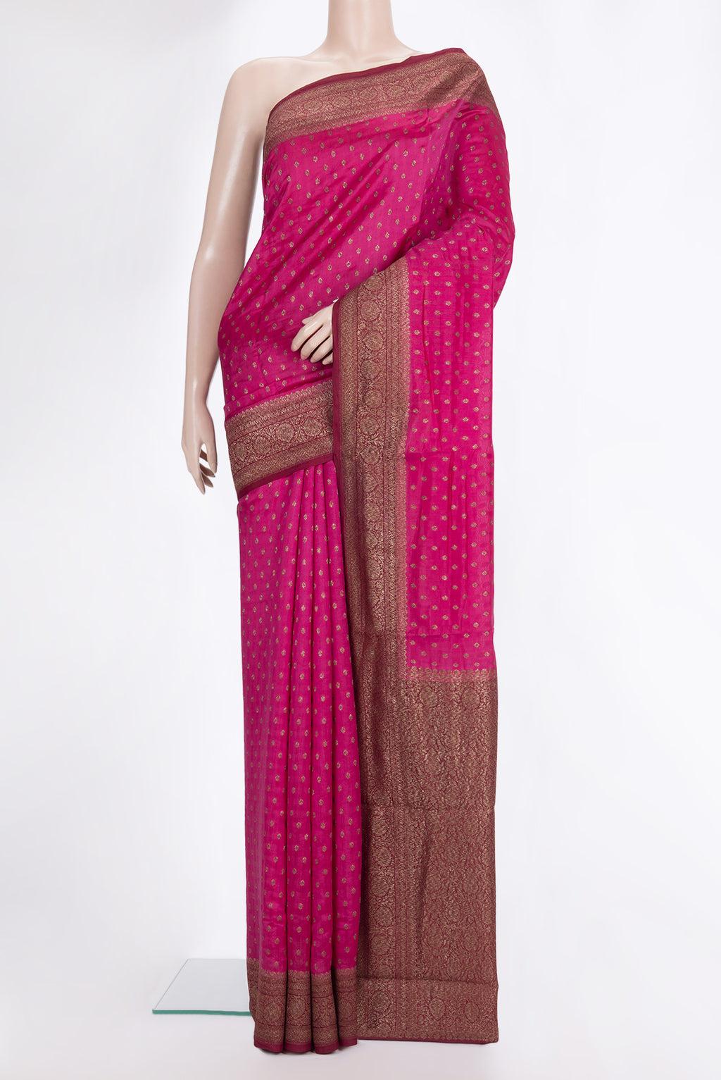 Pure Silk Dark Pink Tussar Saree with Zari Butta on the body and Zari Border.  displayed on a mannequin
