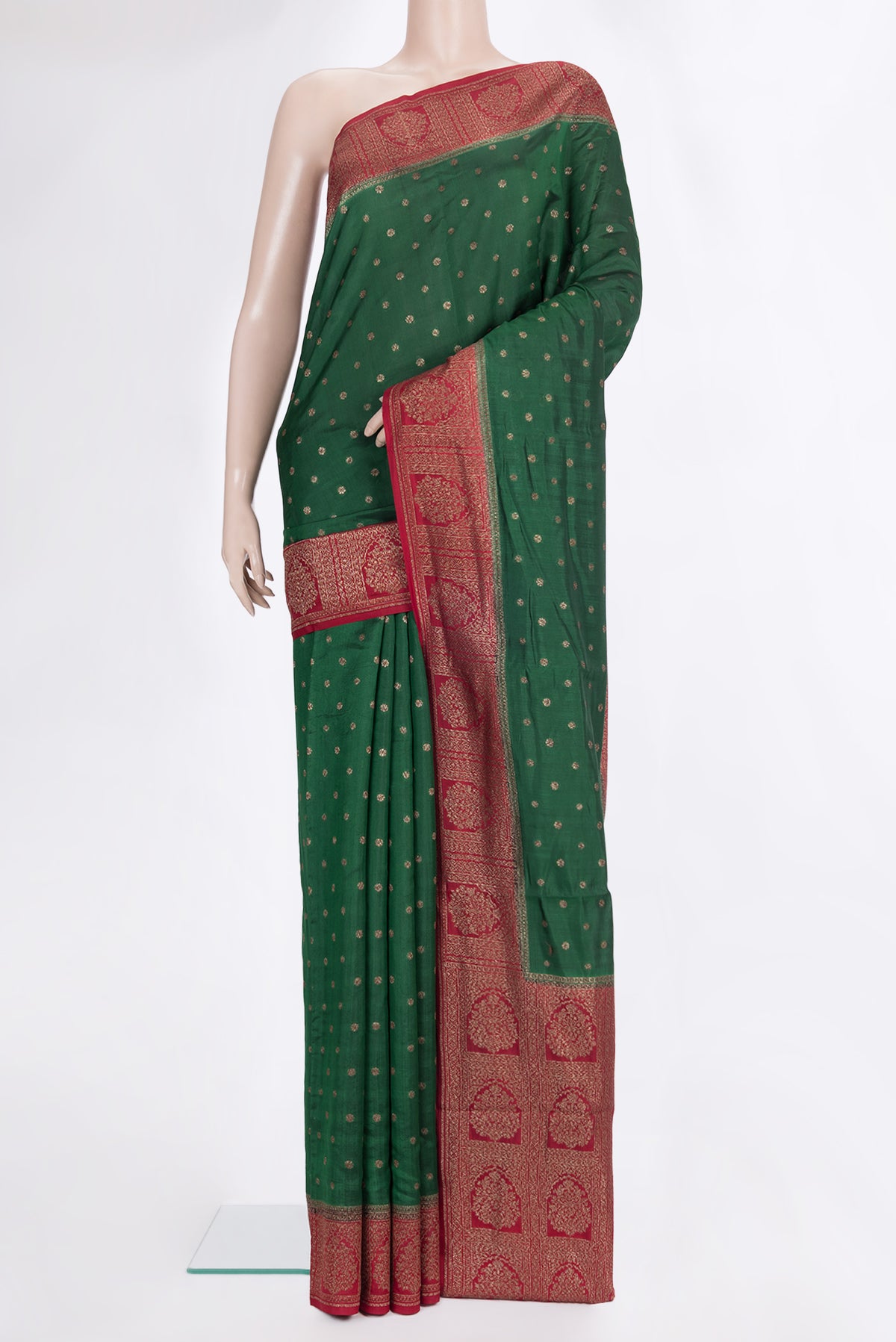Pure Silk Bottle Green Tussar Saree with Zari Butta on the body and Zari Border.  displayed on a mannequin