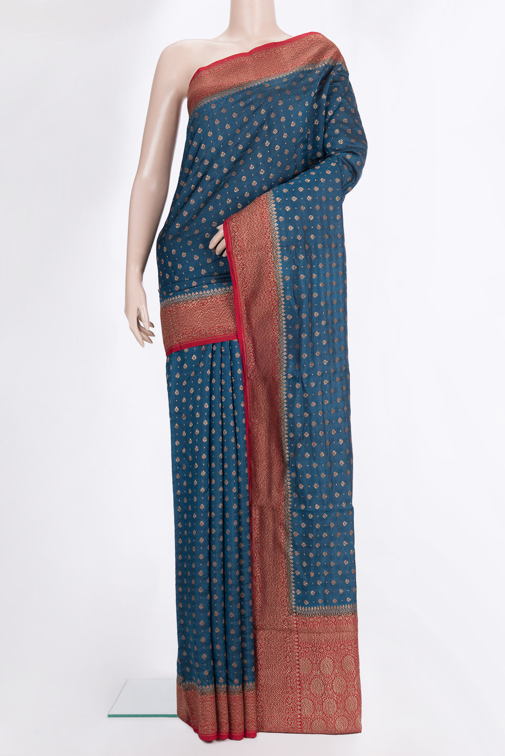 Pure Silk Teal Tussar Saree with Zari Butta on the body and Zari Border.  displayed on a mannequin