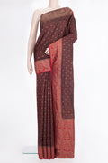 Pure Silk Brown Tussar Saree with Zari Butta on the body and Zari Border.  displayed on a mannequin