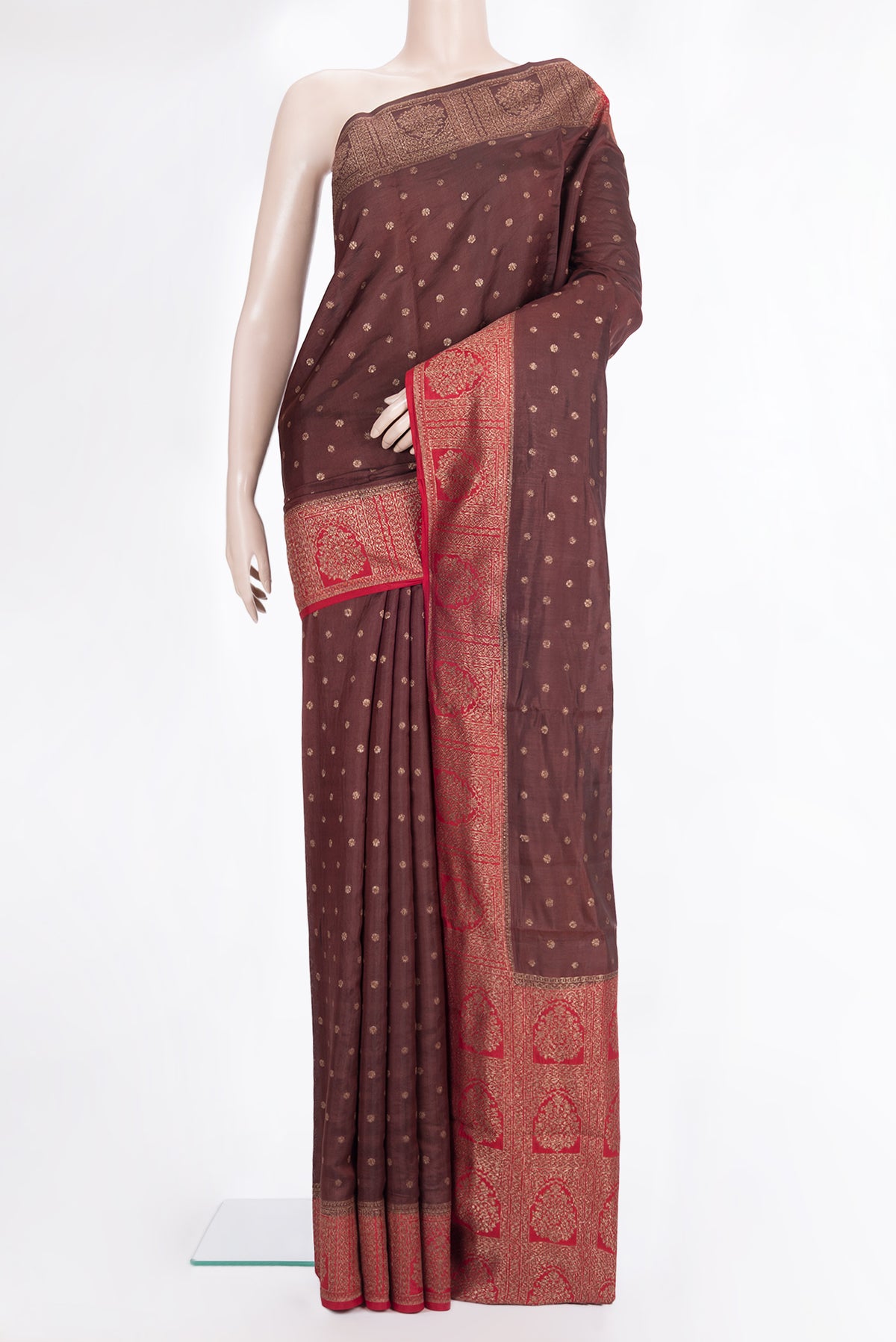 Pure Silk Brown Tussar Saree with Zari Butta on the body and Zari Border.  displayed on a mannequin