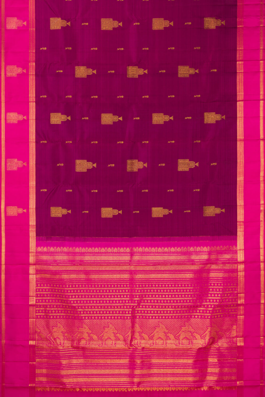 Flat view of Pure Silk Magenta Kanjivaram Saree with Zari Butta on the body and Zari Border. 