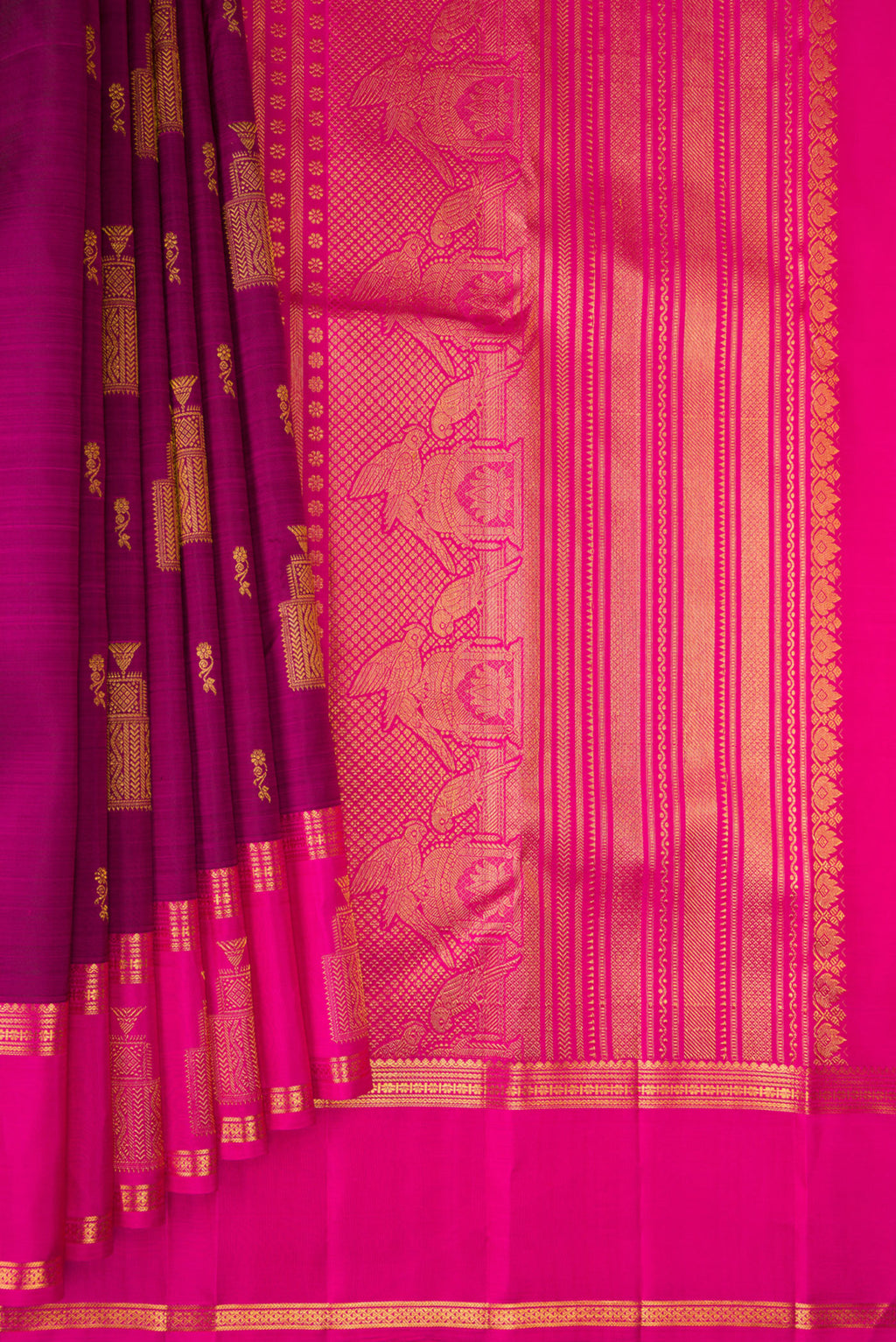 Pleats and pallu of Pure Silk Magenta Kanjivaram Saree with Zari Butta on the body and Zari Border. 