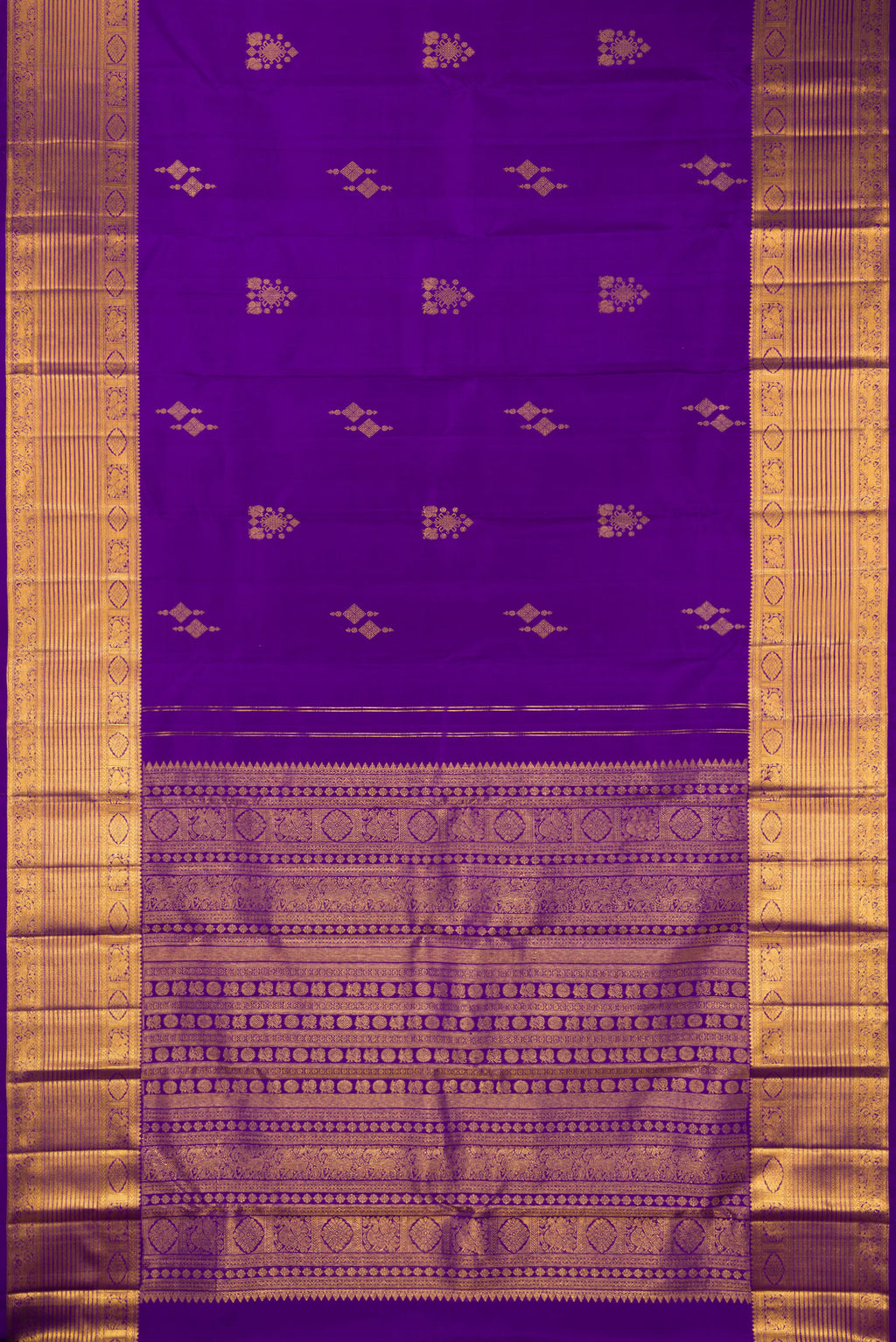 Flat view of Pure Silk Violet Kanjivaram Saree with Zari Butta on the body and Zari Border. 