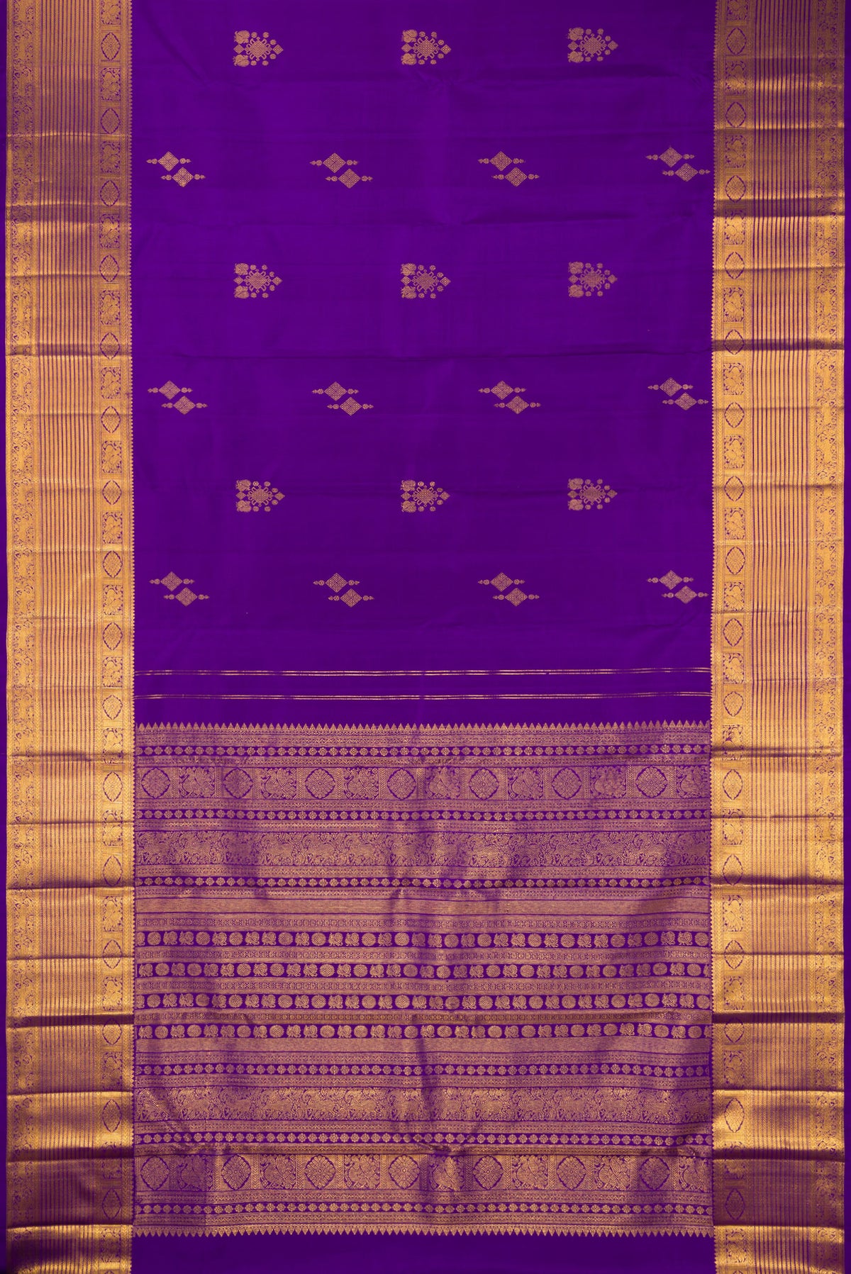 Flat view of Pure Silk Violet Kanjivaram Saree with Zari Butta on the body and Zari Border. 