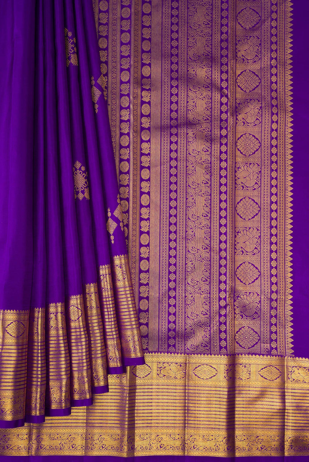 Pleats and pallu of Pure Silk Violet Kanjivaram Saree with Zari Butta on the body and Zari Border. 