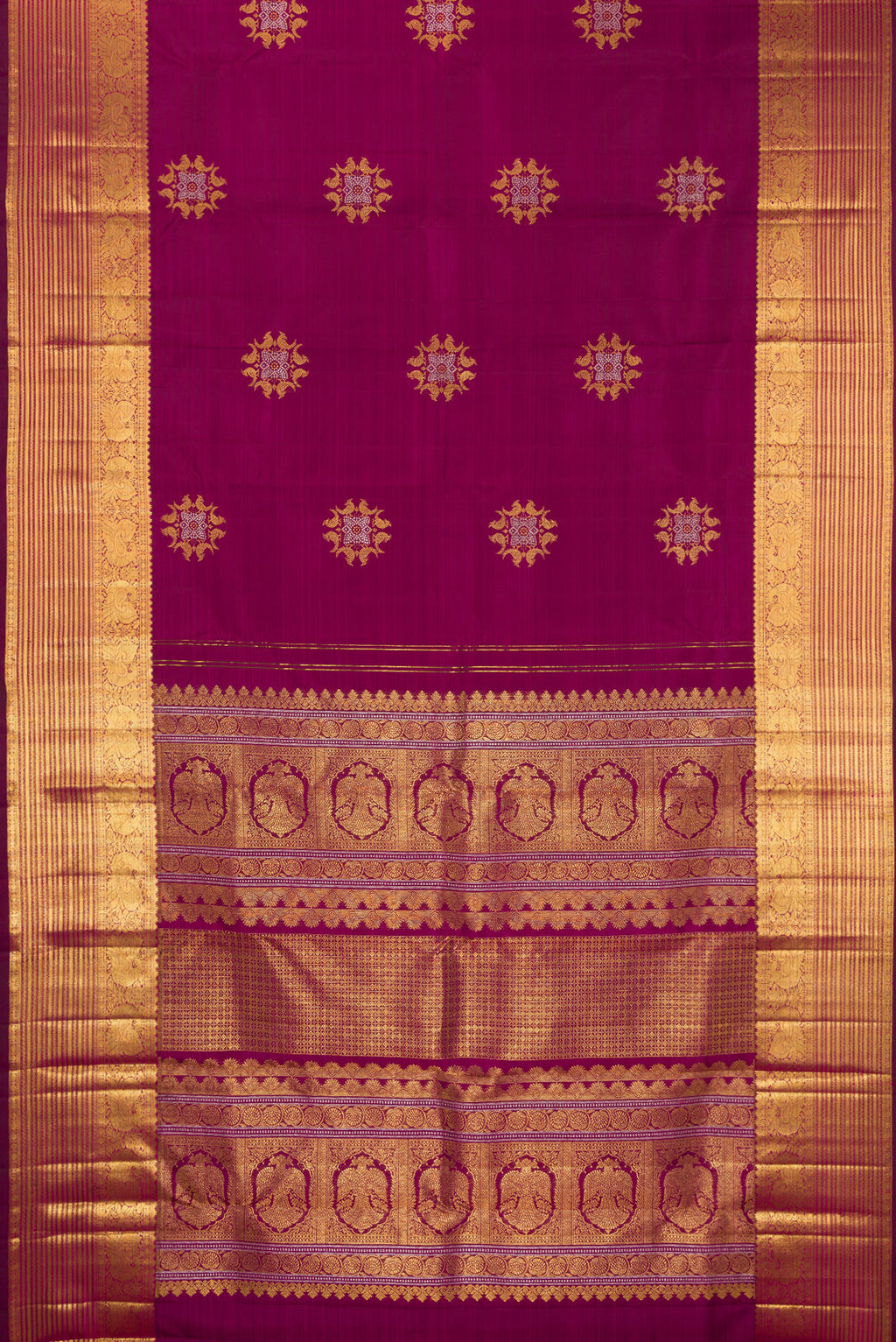 Flat view of Pure Silk Magenta Kanjivaram Saree with Zari Butta on the body and Zari Border. 