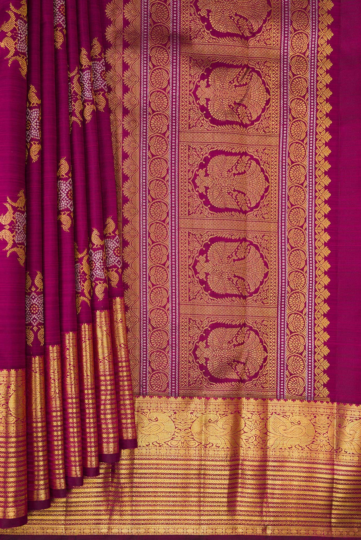 Pleats and pallu of Pure Silk Magenta Kanjivaram Saree with Zari Butta on the body and Zari Border. 