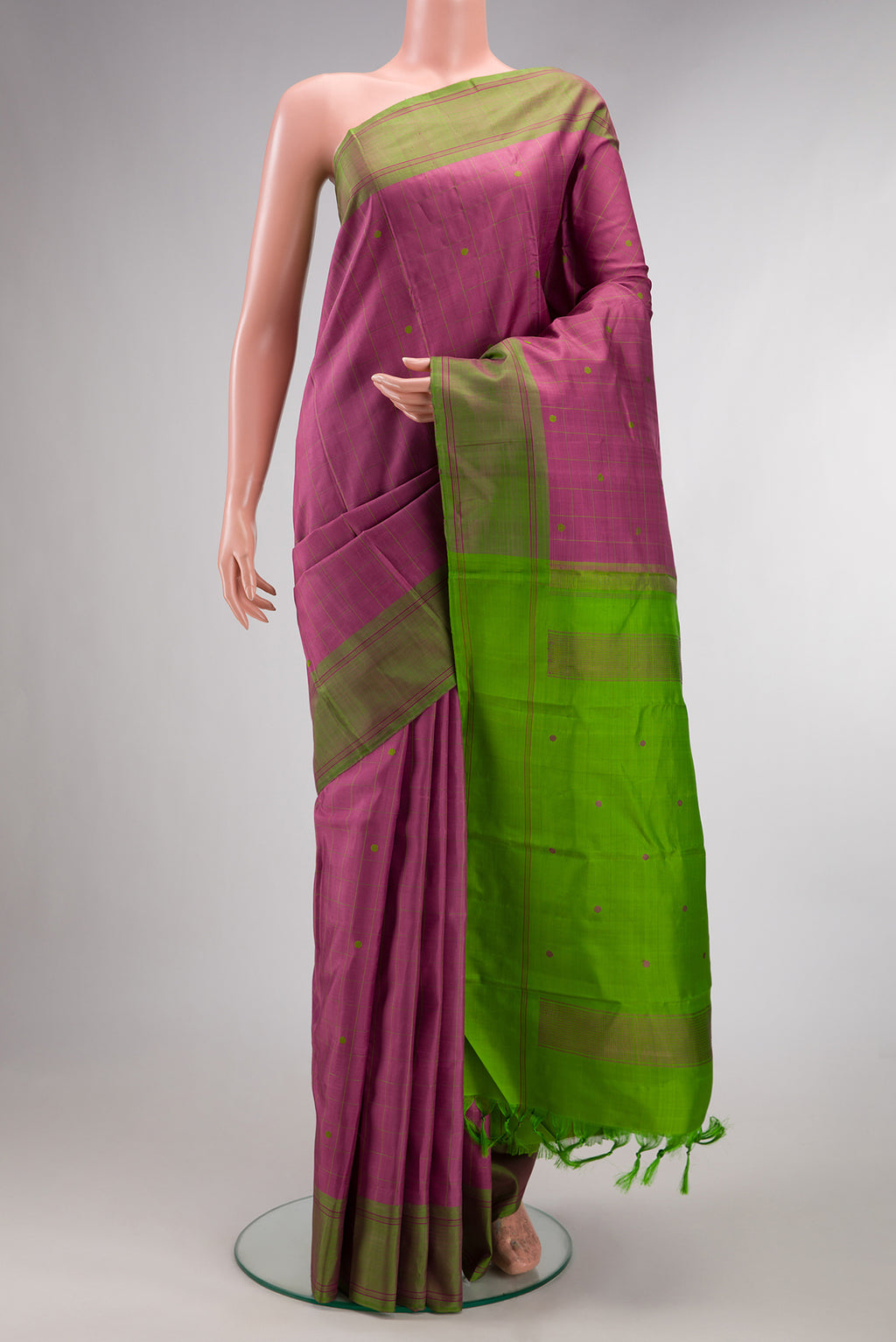 Pure Silk Pink Kanjivaram Saree with Checked design on the body and Plain Border.  displayed on a mannequin