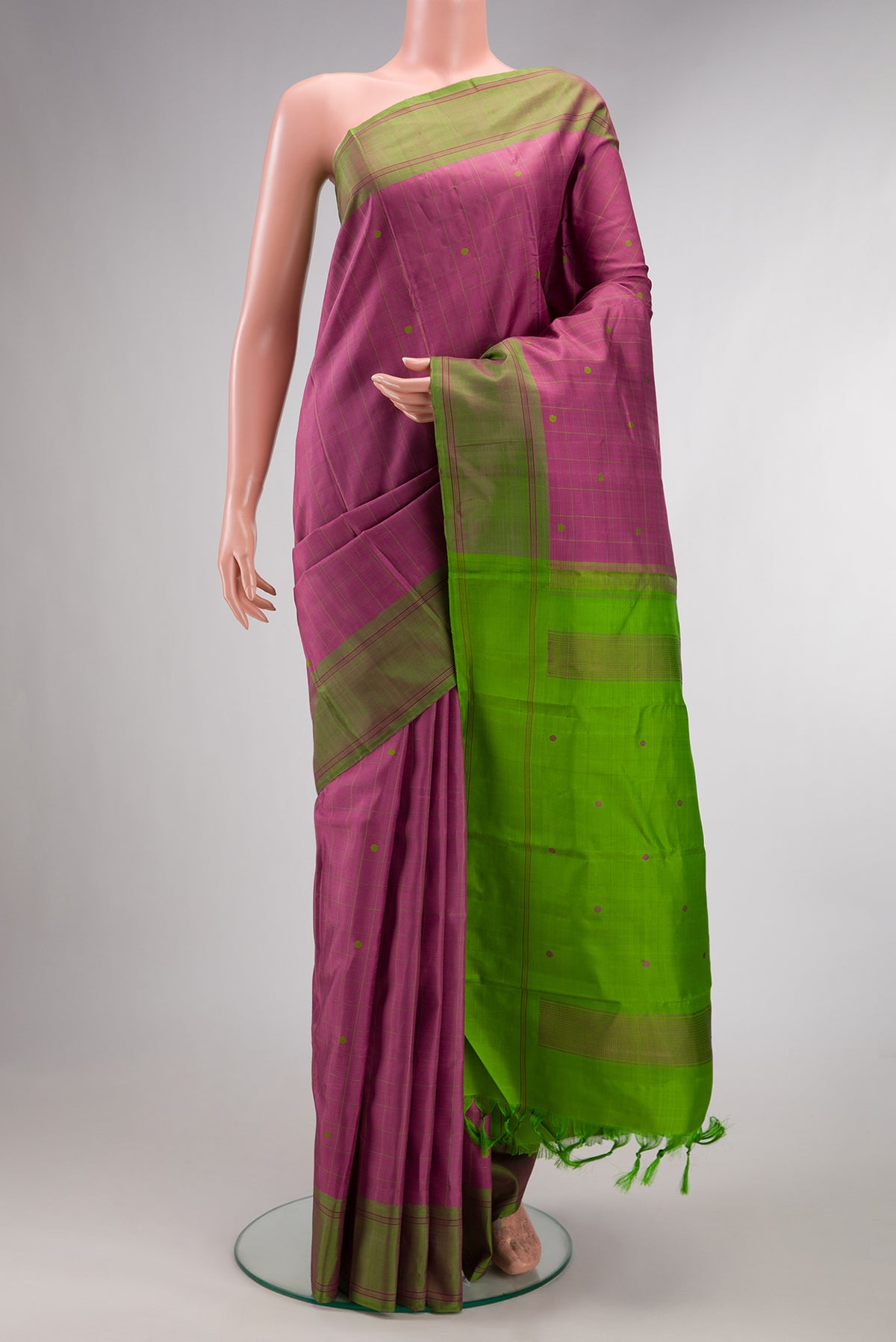 Pure Silk Pink Kanjivaram Saree with Checked design on the body and Plain Border.  displayed on a mannequin