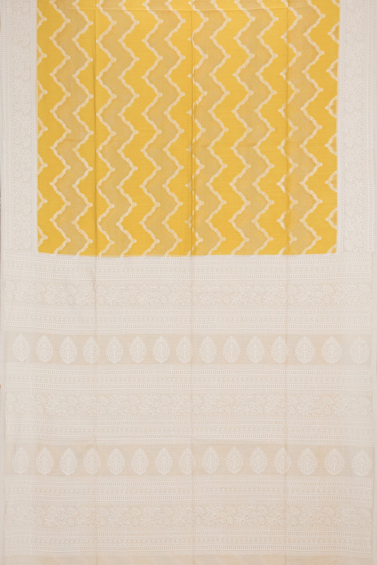 Flat view of Yellow Tussar Saree with Zari Brocade on the body and Embroidered Border. 