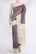 Brown Tussar Saree with Embroidered on the body and Embroidered Border.  displayed on a mannequin