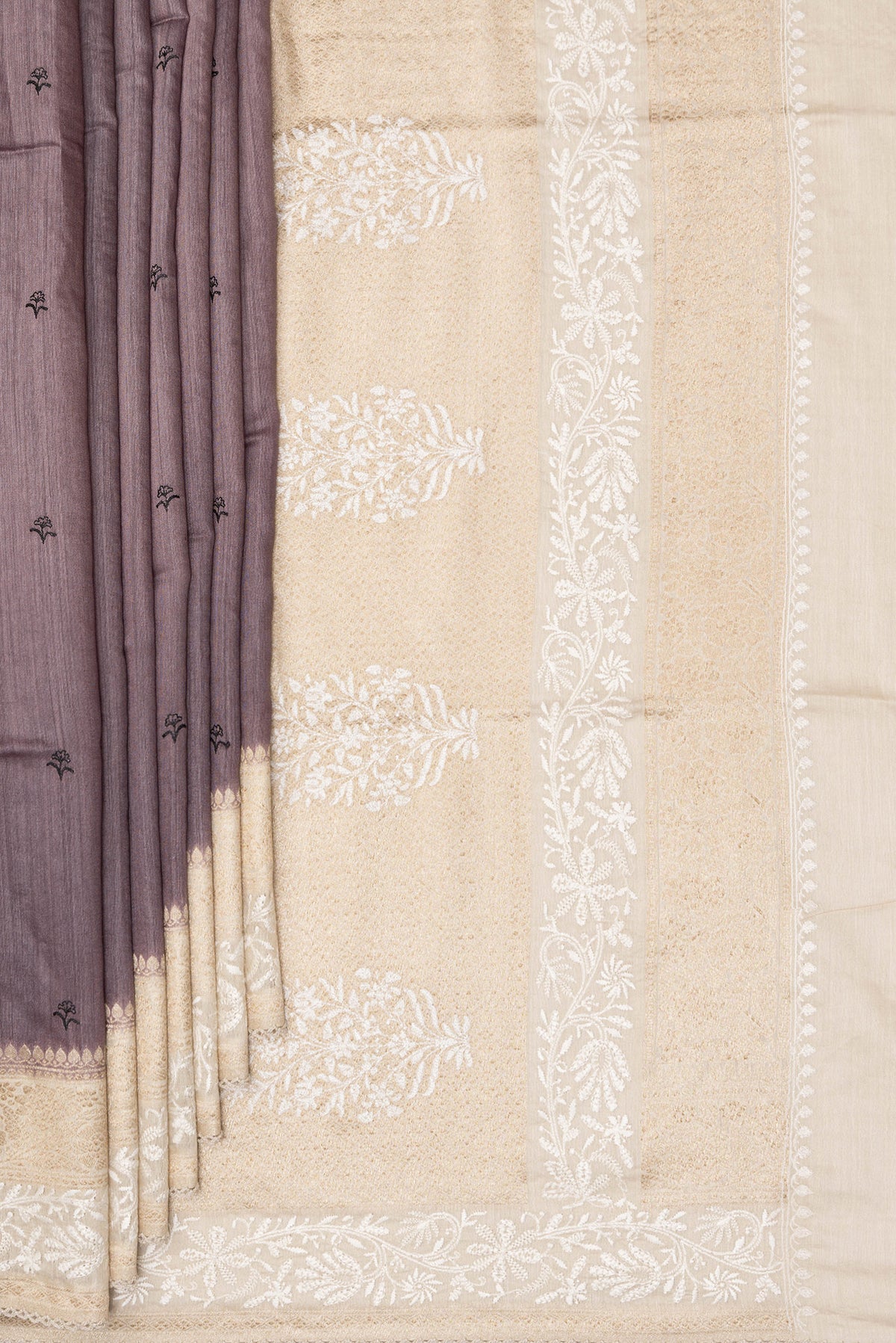 Pleats and pallu of Brown Tussar Saree with Embroidered on the body and Embroidered Border. 