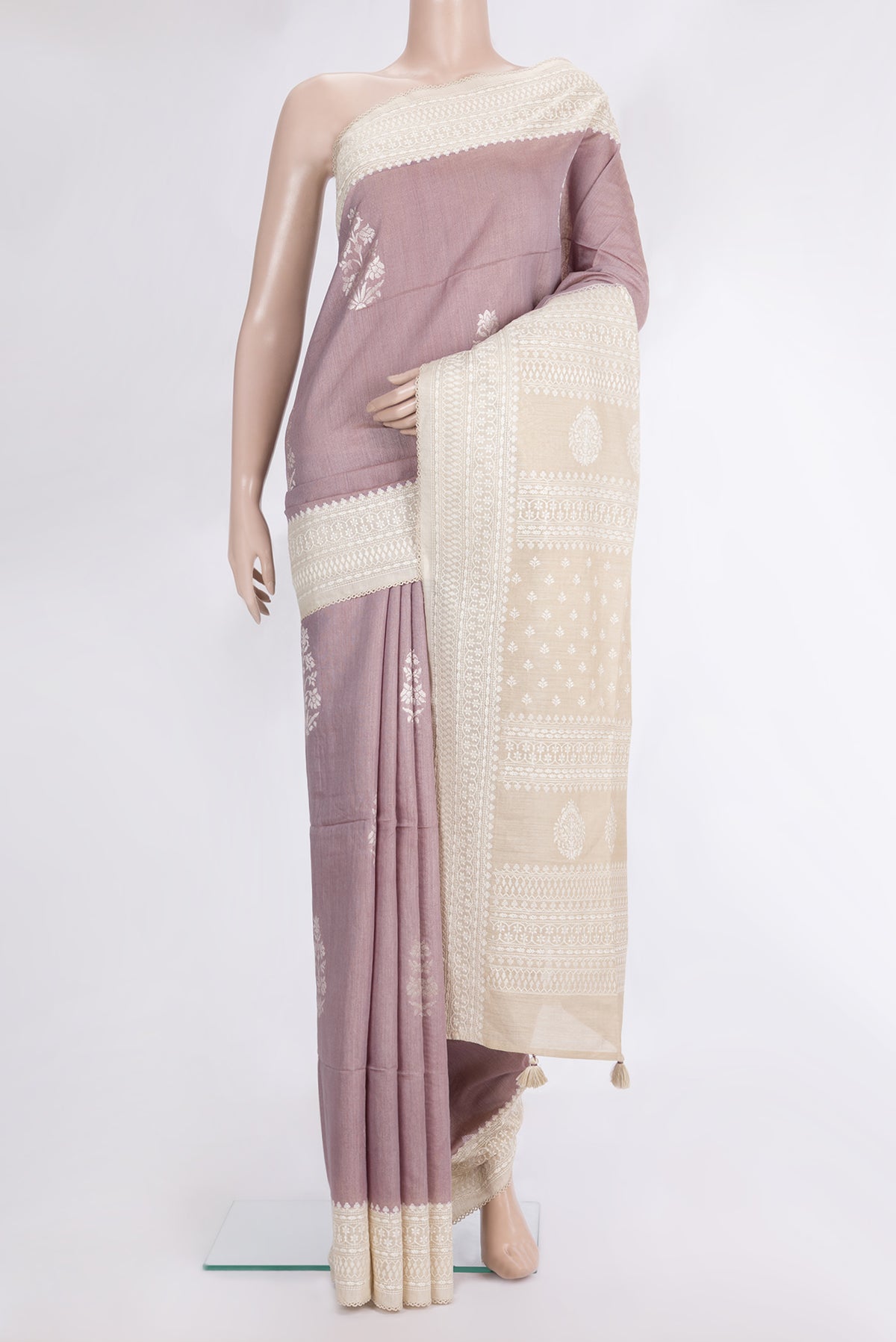 Pure Silk Rose Gold Dual Tone Tussar Saree with Zari Butta on the body and Embroidered Border.  displayed on a mannequin
