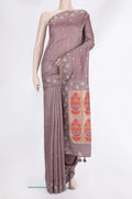 Brown Tussar Saree with Embroidered on the body and Embroidered Border.  displayed on a mannequin