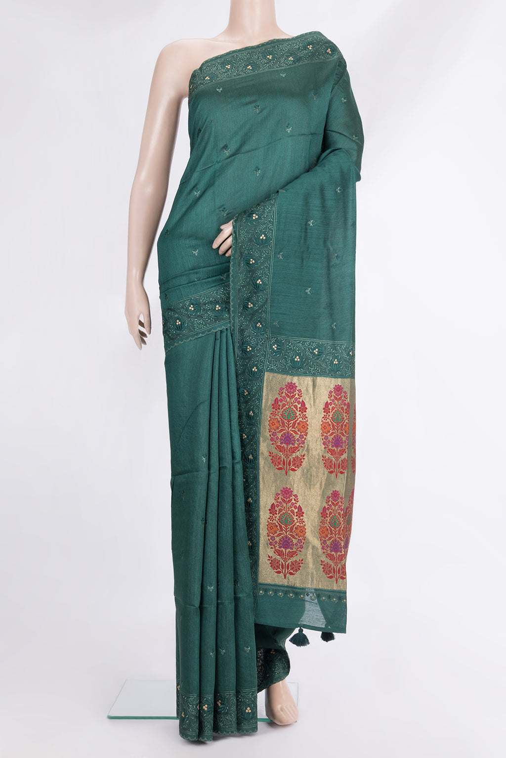 Bottle Green Tussar Saree with Embroidered on the body and Embroidered Border.  displayed on a mannequin