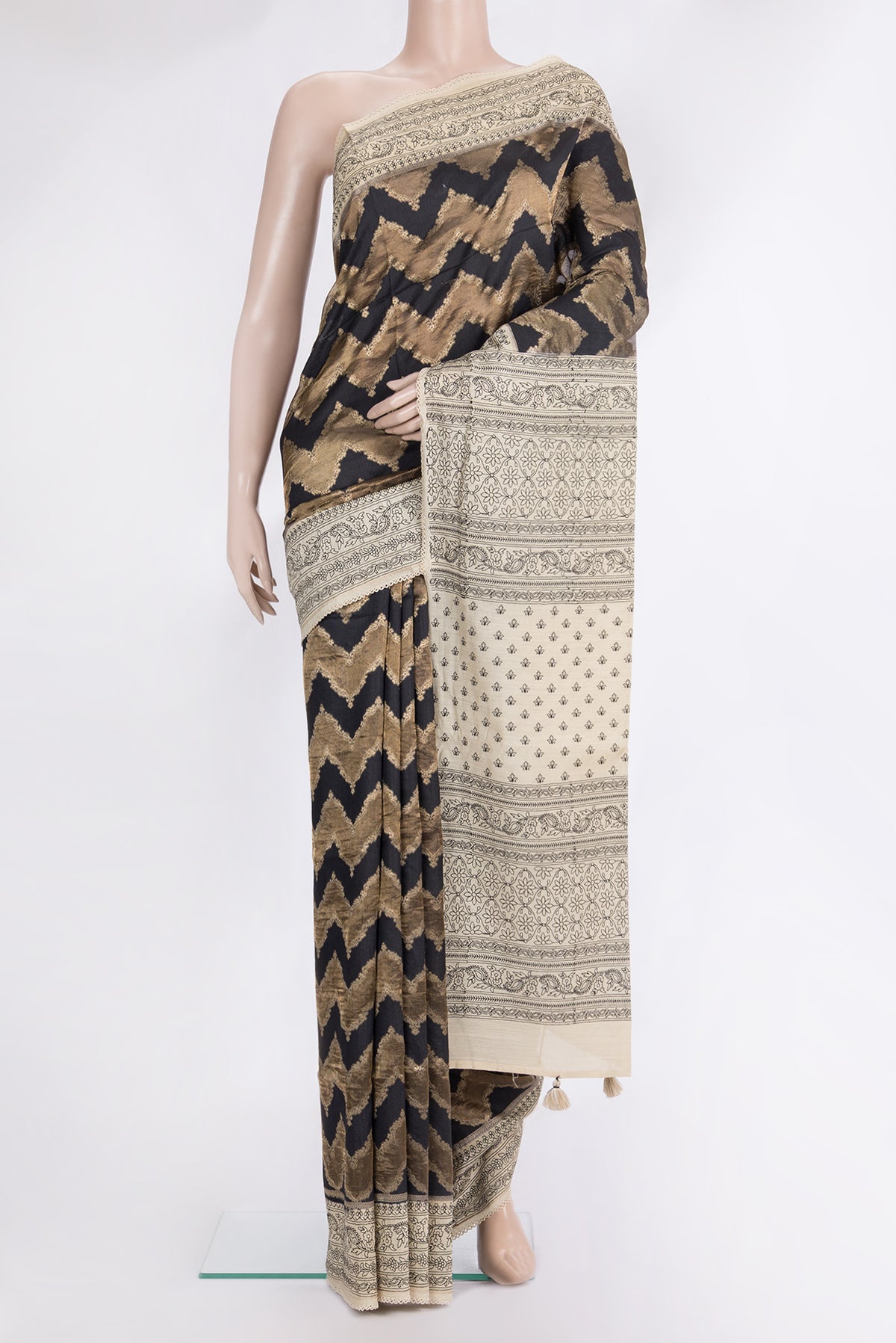 Black Tussar Saree with Zari Brocade on the body and Embroidered Border.  displayed on a mannequin