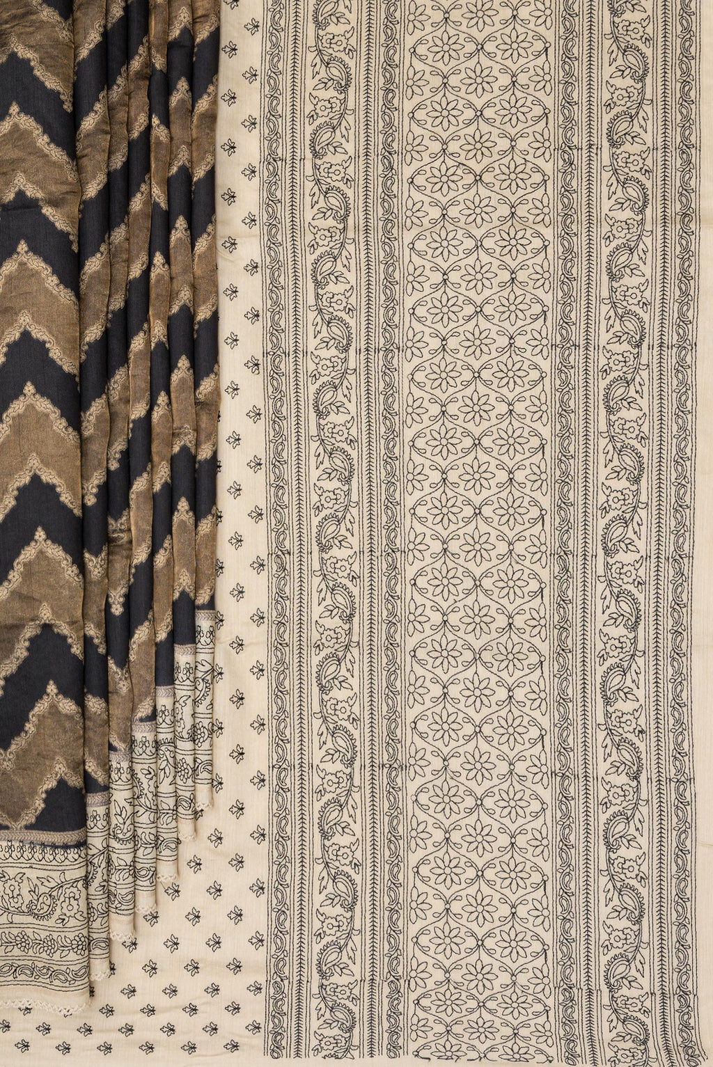 Pleats and pallu of Black Tussar Saree with Zari Brocade on the body and Embroidered Border. 