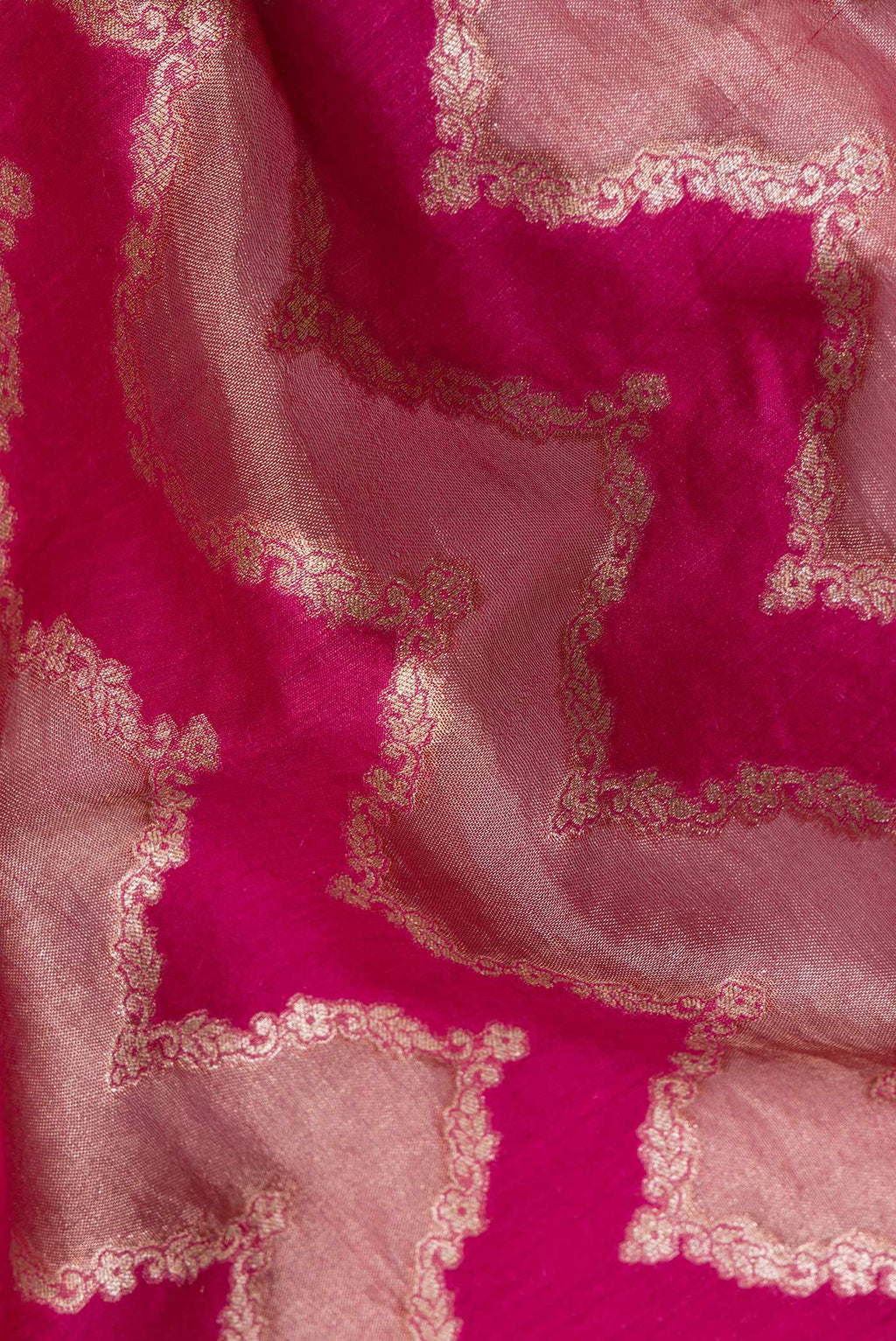 Close up of Pure Silk Dark Pink Dual Tone Tussar Saree with Zari Brocade on the body and Embroidered Border.  displaying folds