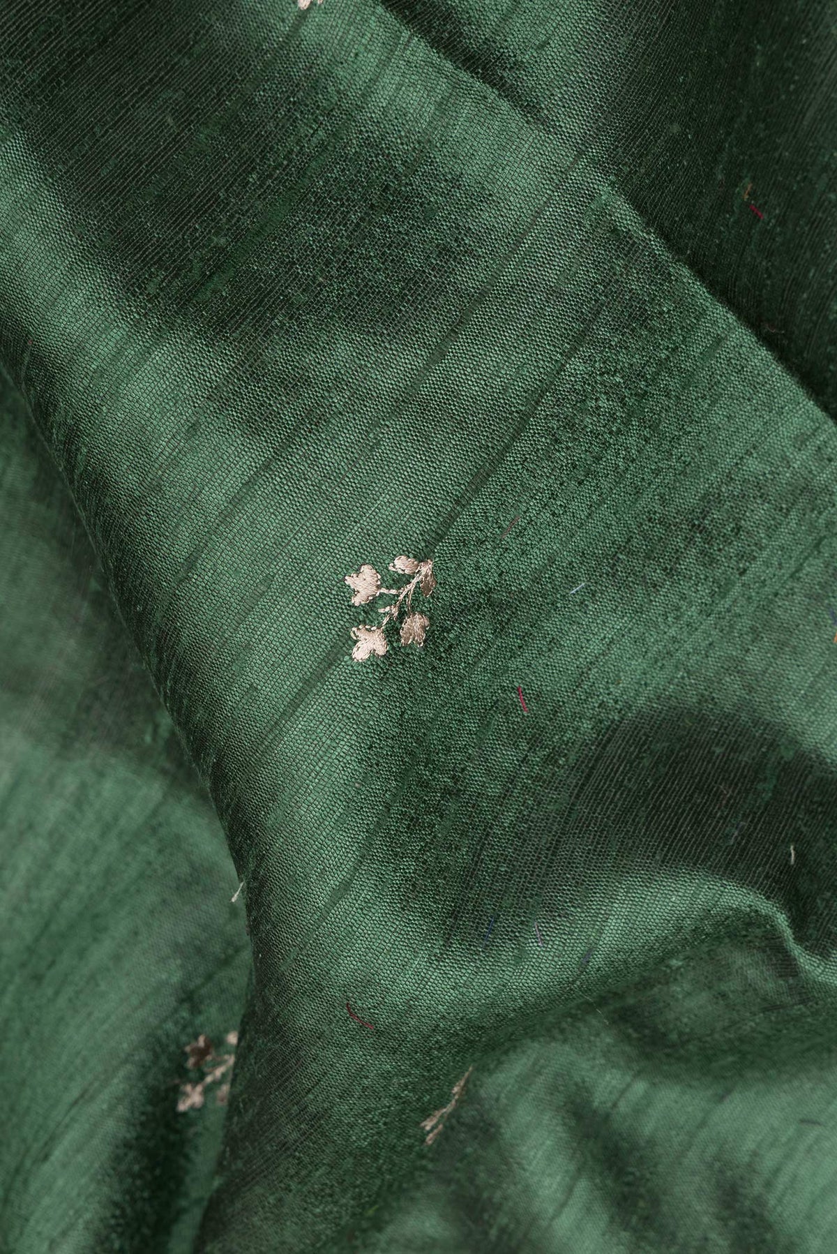 Close up of Pure Silk Green Tussar Saree with Embroidered on the body and Embroidered Border.  displaying folds
