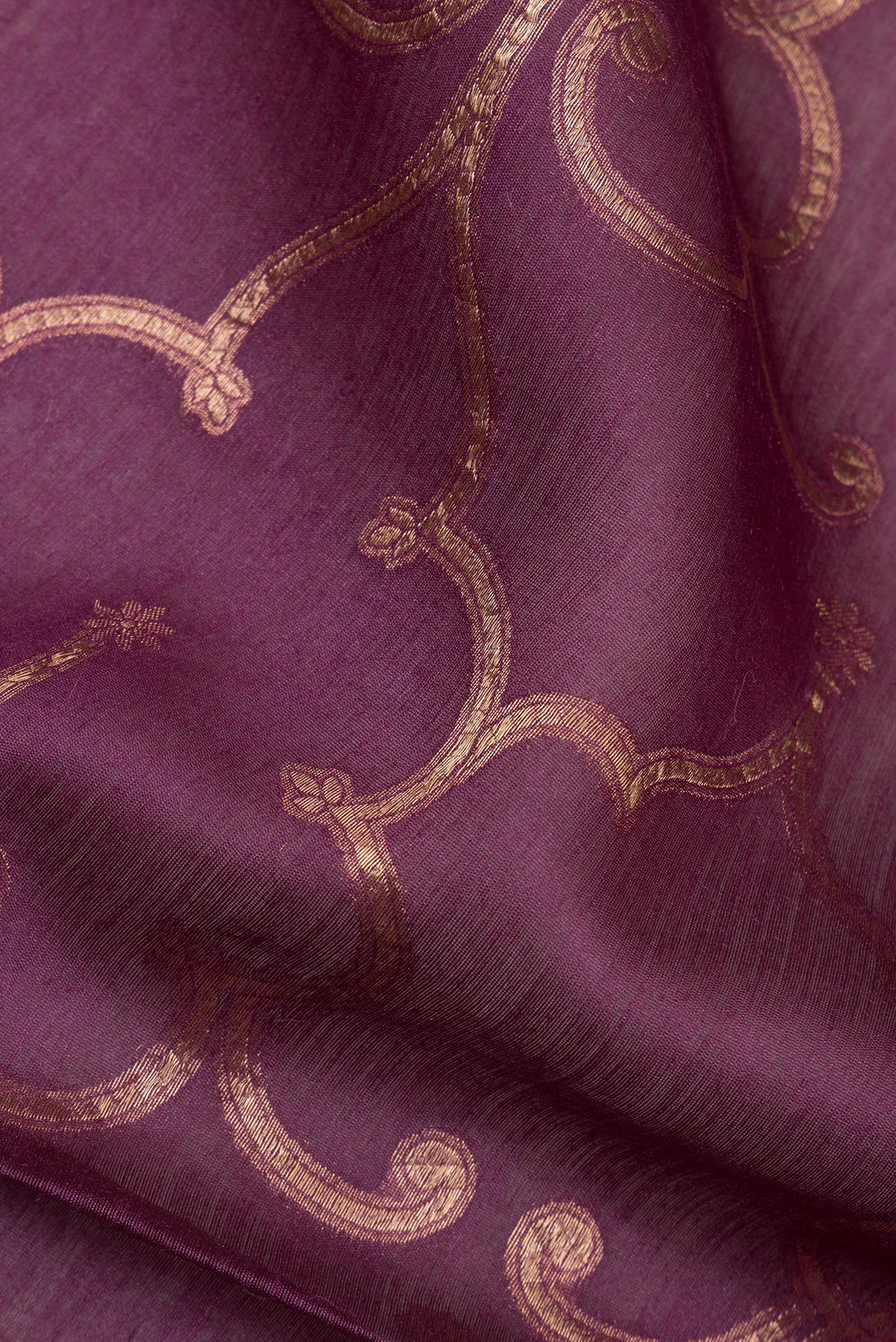 Close up of Pure Silk Mauve Tussar Saree with Zari Brocade on the body and Embroidered Border.  displaying folds