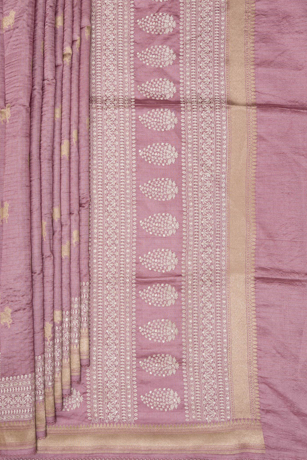Pleats and pallu of Pure Silk Rose Gold Tussar Saree with Checked design on the body and Embroidered Border. 