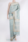 Pure Silk Light Blue Tussar Saree with Checked design on the body and Embroidered Border.  displayed on a mannequin