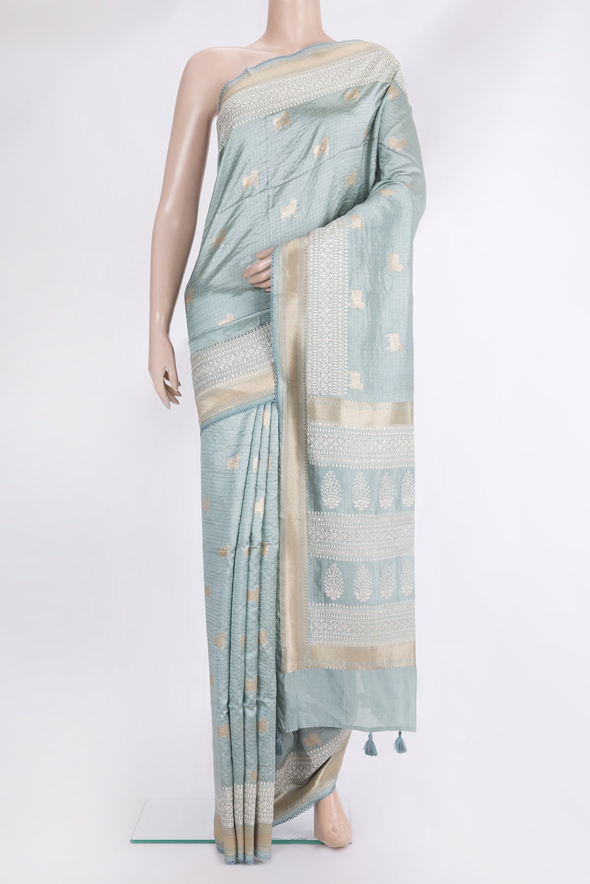 Pure Silk Light Blue Tussar Saree with Checked design on the body and Embroidered Border.  displayed on a mannequin