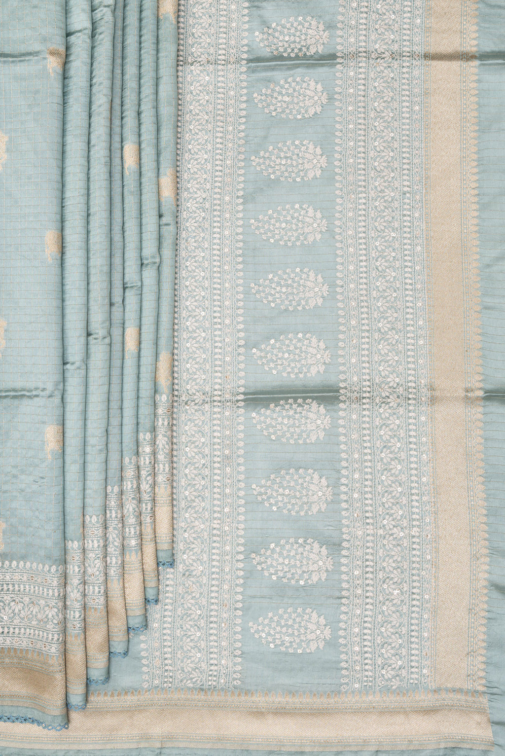 Pleats and pallu of Pure Silk Light Blue Tussar Saree with Checked design on the body and Embroidered Border. 