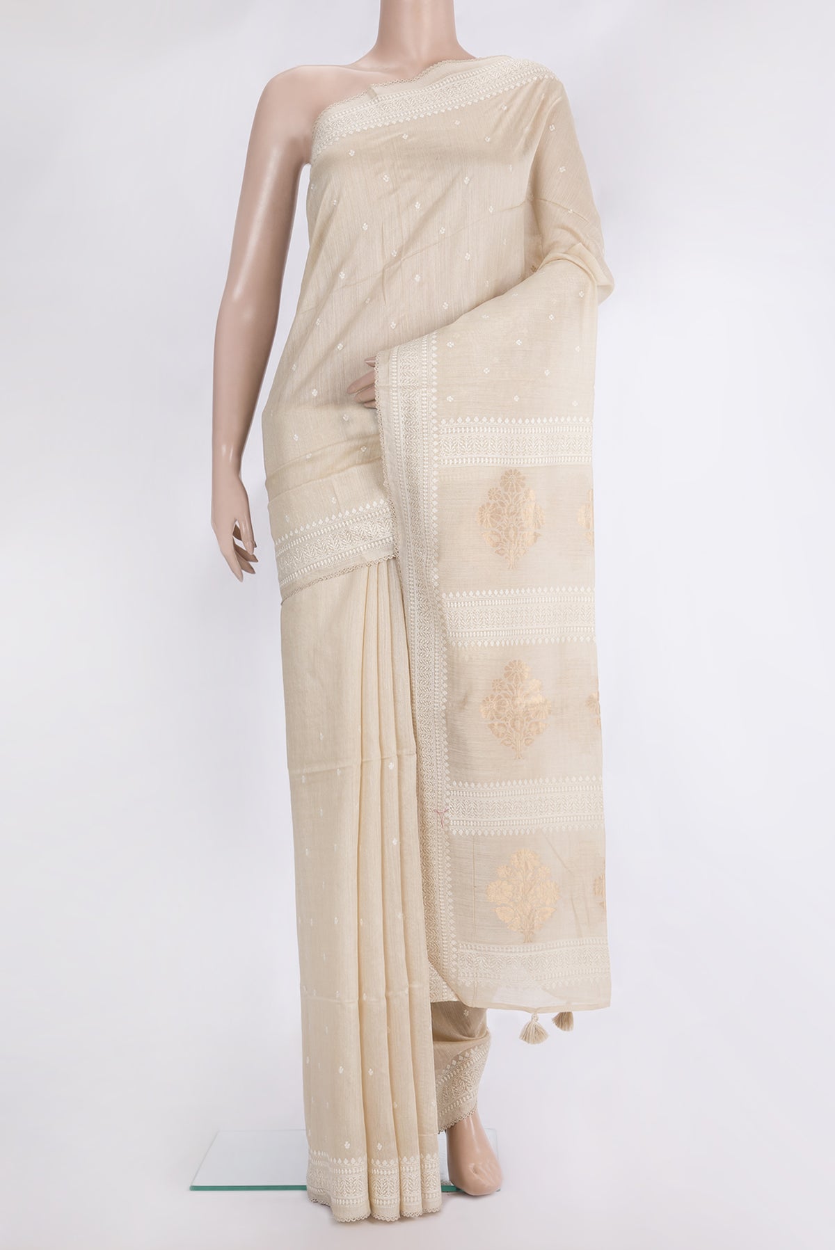 Cream Tussar Saree with Embroidered on the body and Embroidered Border.  displayed on a mannequin
