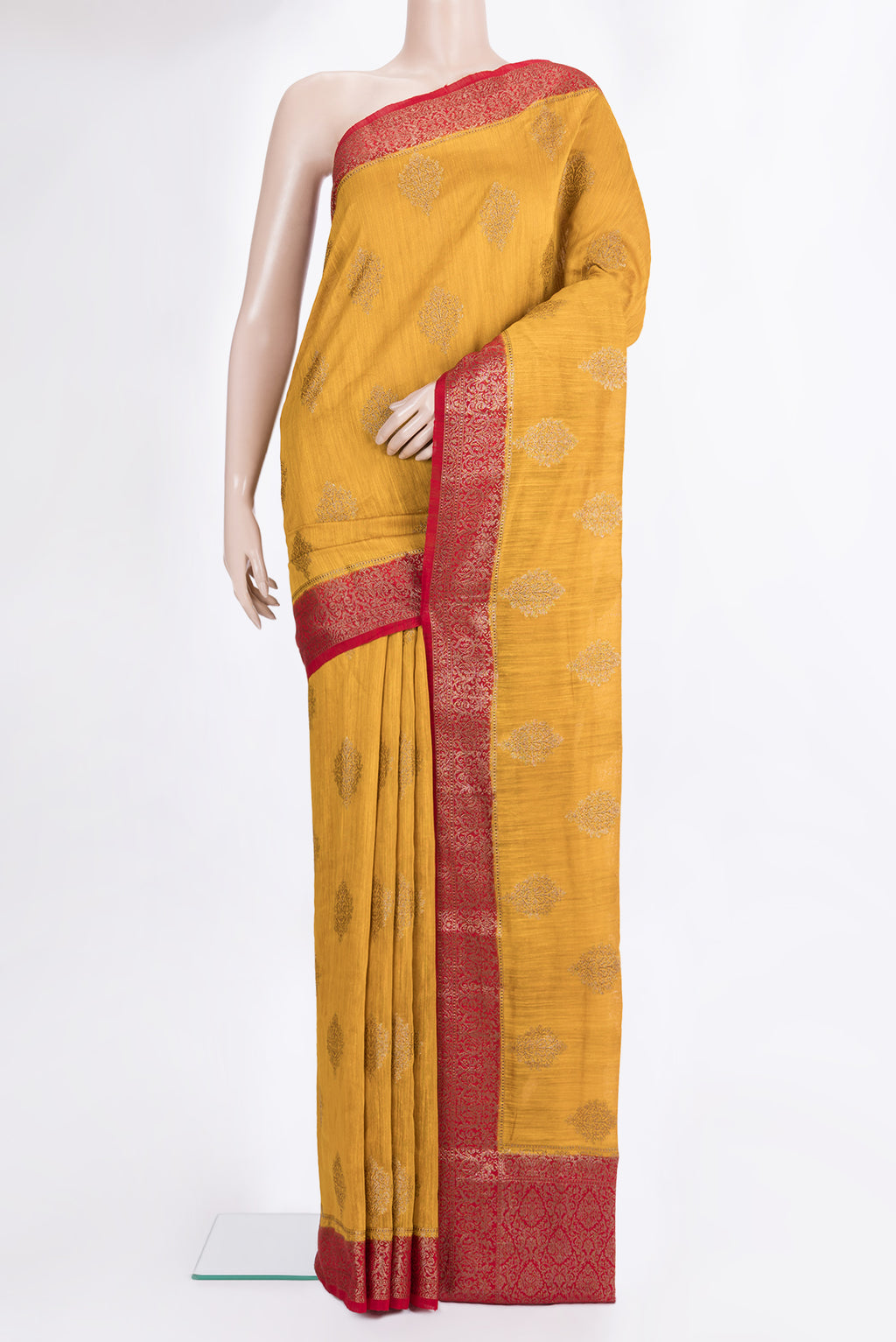 Yellow Raw Saree with Zari Butta on the body and Zari Border.  displayed on a mannequin
