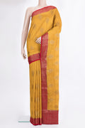 Yellow Raw Saree with Zari Butta on the body and Zari Border.  displayed on a mannequin