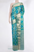 Pure Silk Sea Green and Peacock Blue Color Kanjivaram Saree with Zari Brocade on the body and Zari Border.  displayed on a mannequin