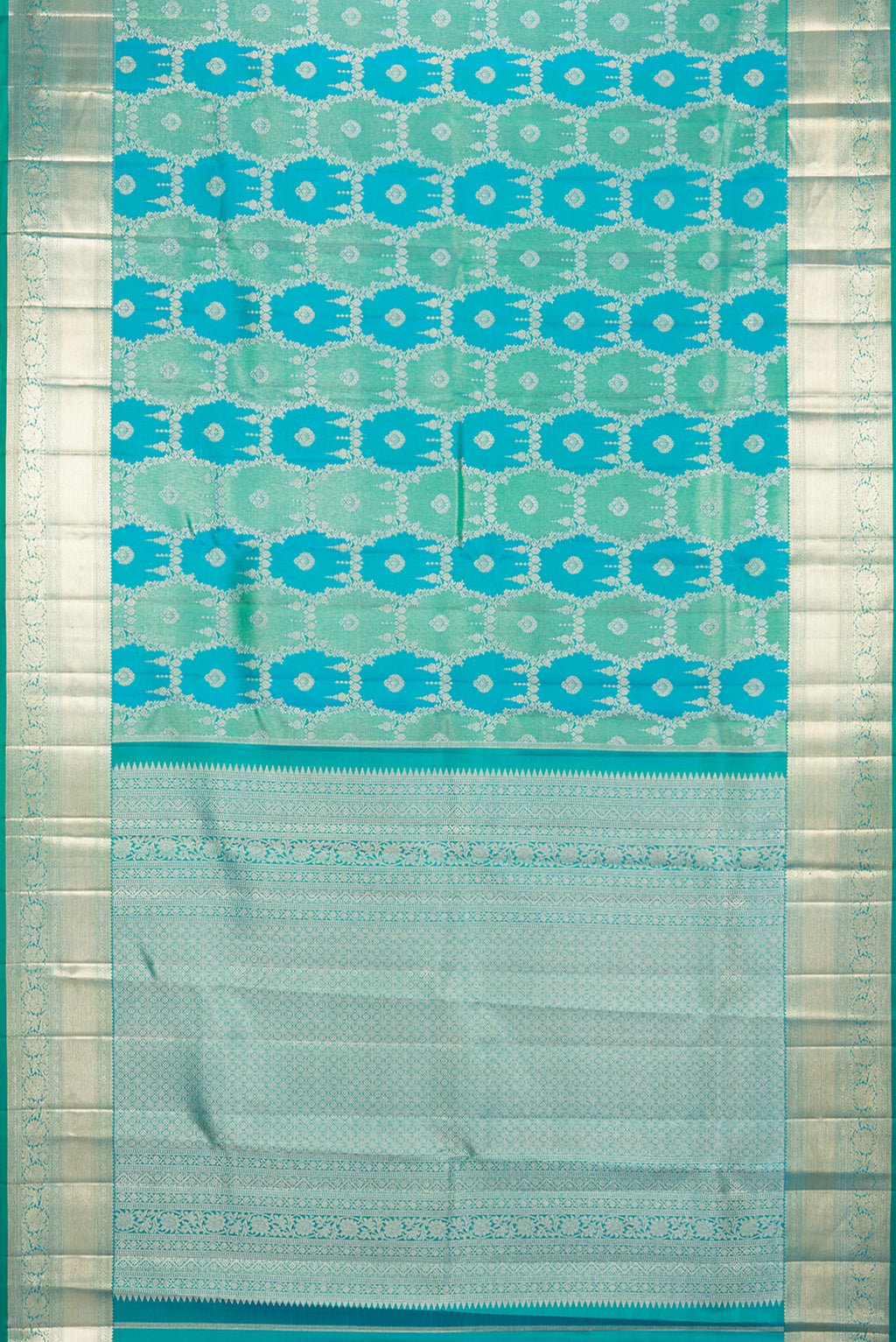 Flat view of Pure Silk Sea Green and Peacock Blue Color Kanjivaram Saree with Zari Brocade on the body and Zari Border. 